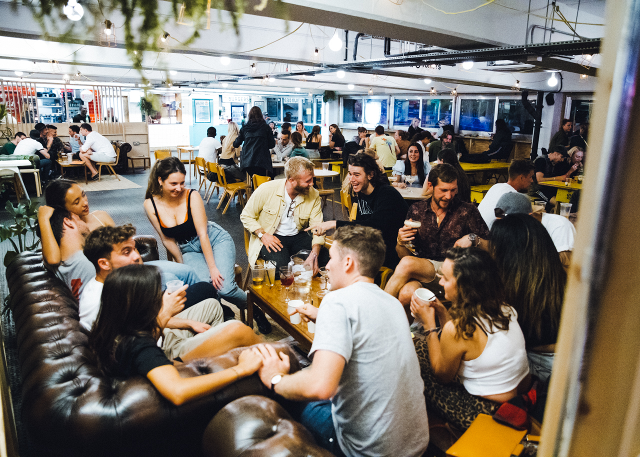 Vibrant social gathering at The Bar and Food Hall, perfect for networking events.