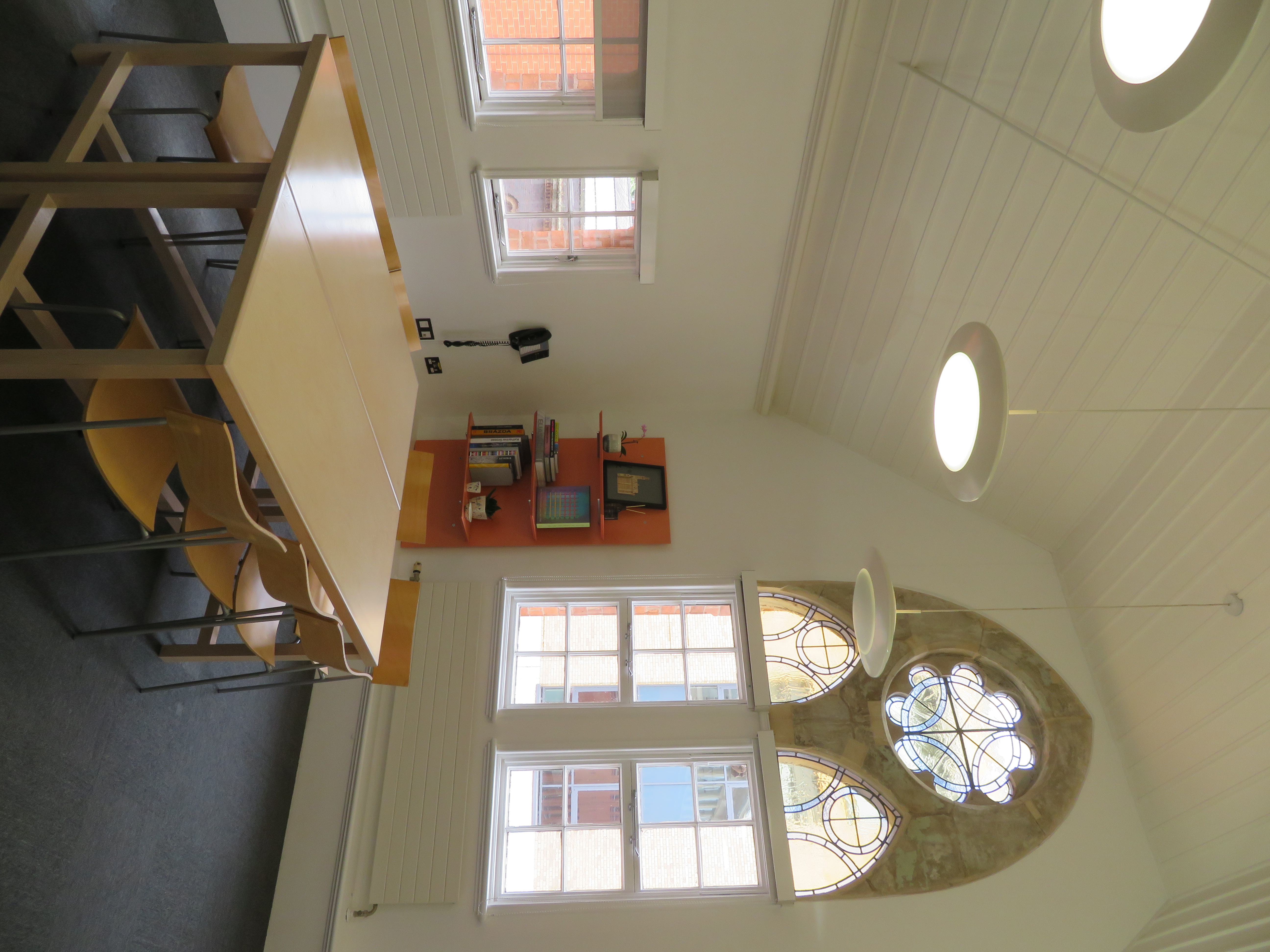 Bright meeting space in Ikon Gallery with large table, ideal for workshops and discussions.