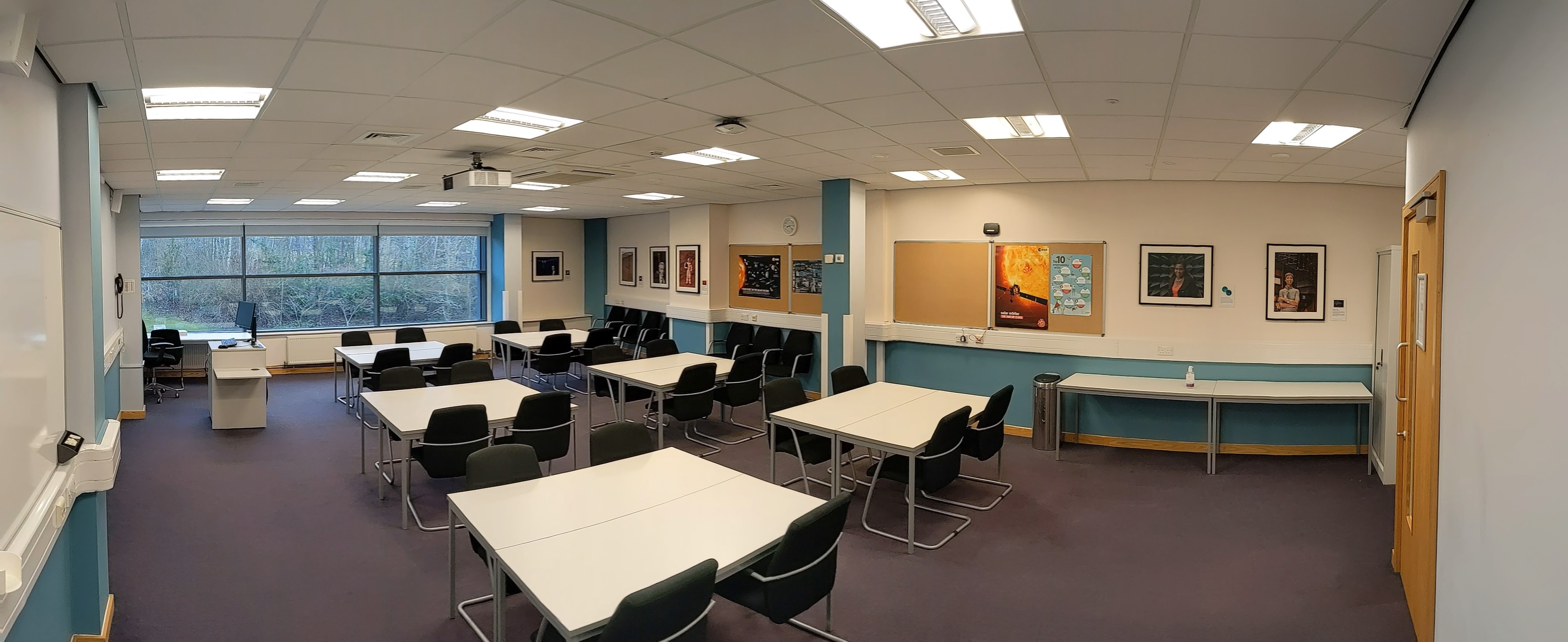 Versatile teaching room with natural light for STEM workshops and meetings.