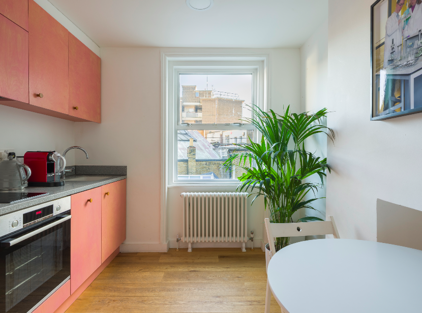 Modern kitchenette in Mimosa House, ideal for networking and casual meetings.