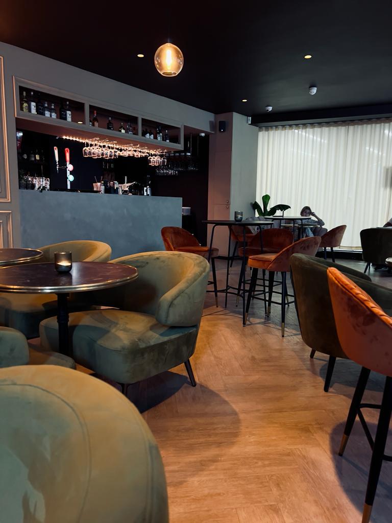 Stylish modern bar venue with plush seating for networking events and gatherings.