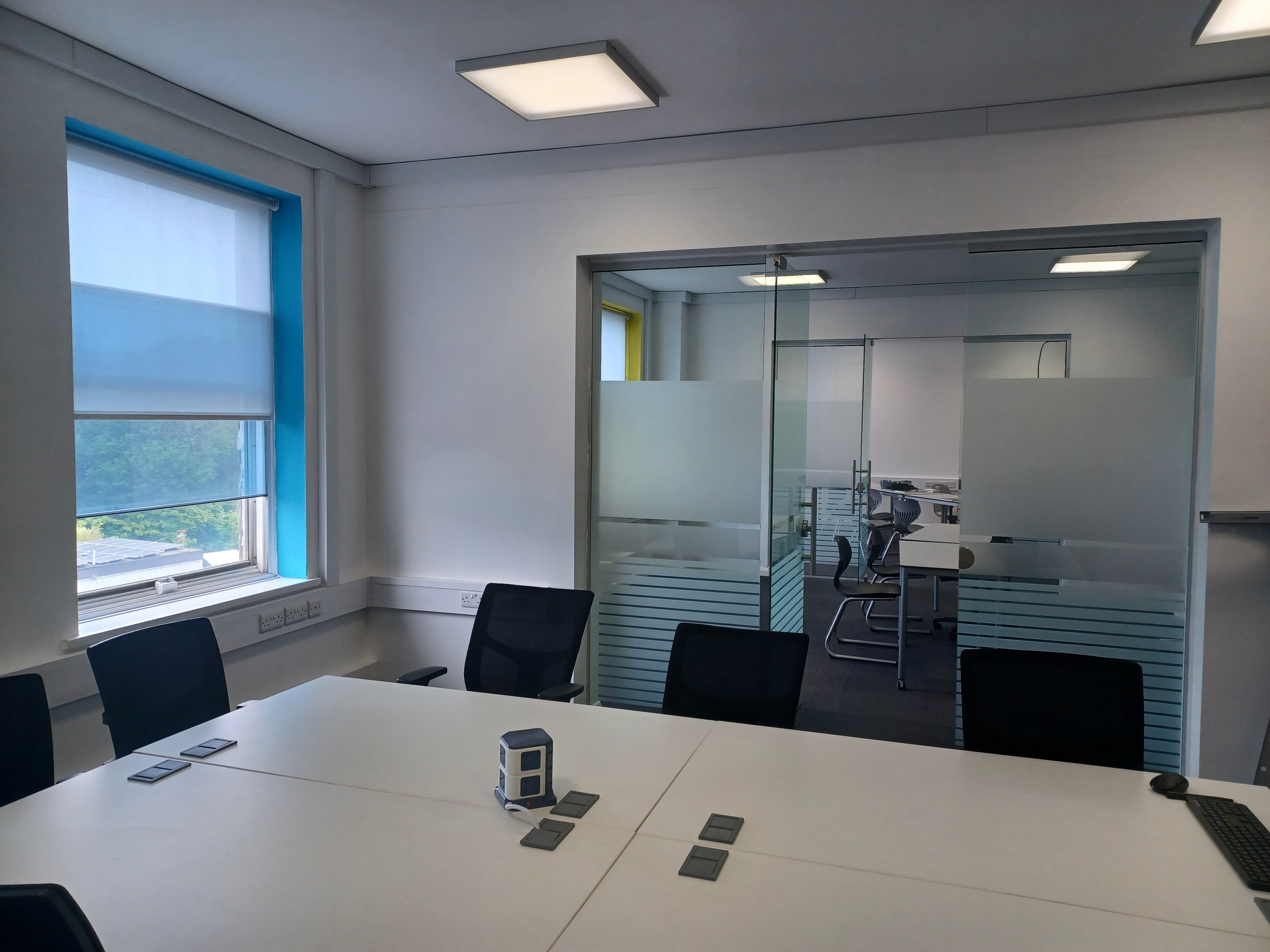 Modern meeting room at BSC Brighton with large table, ideal for brainstorming sessions.