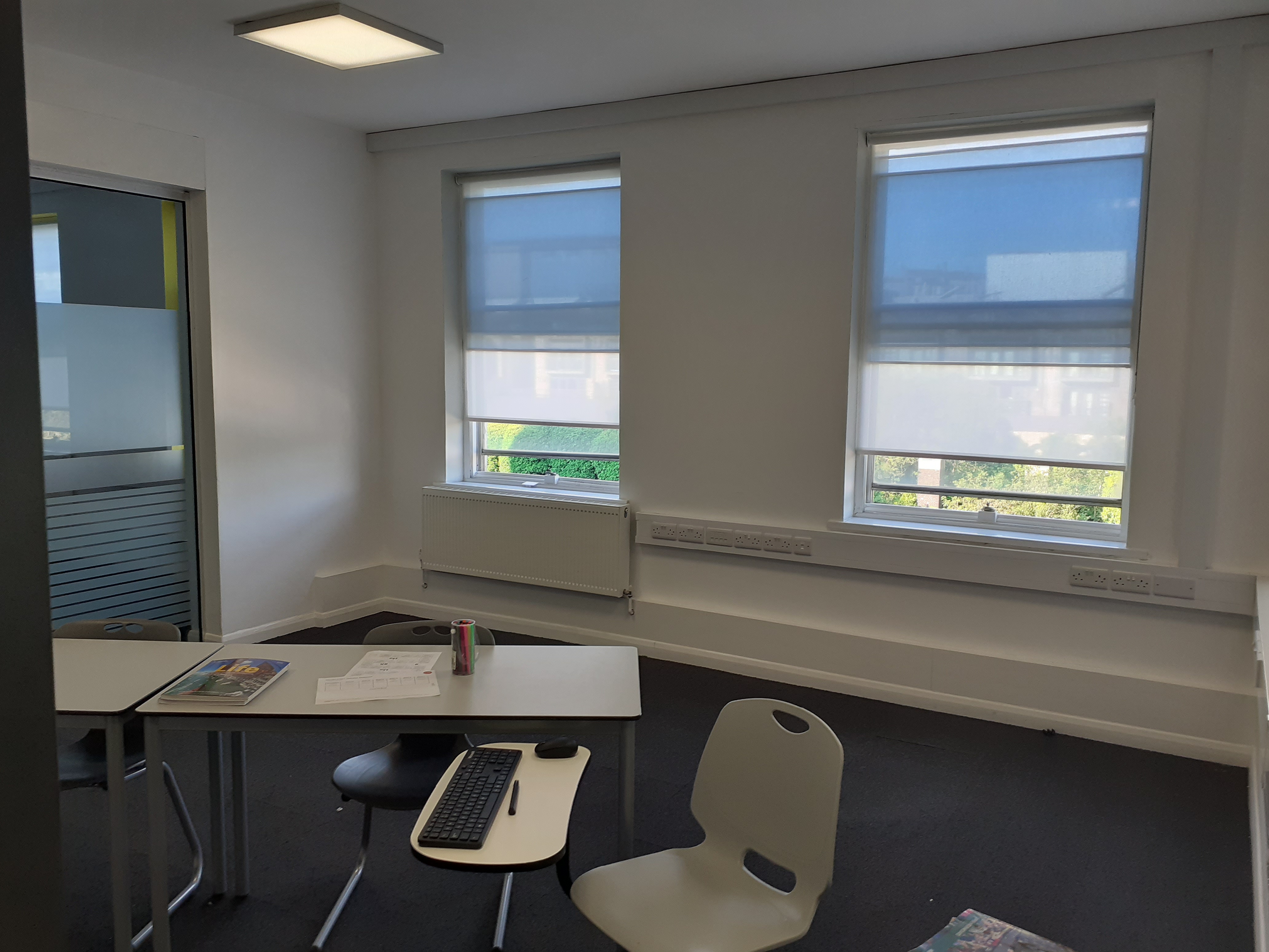 Minimalist meeting room at BSC Brighton, perfect for brainstorming sessions and gatherings.