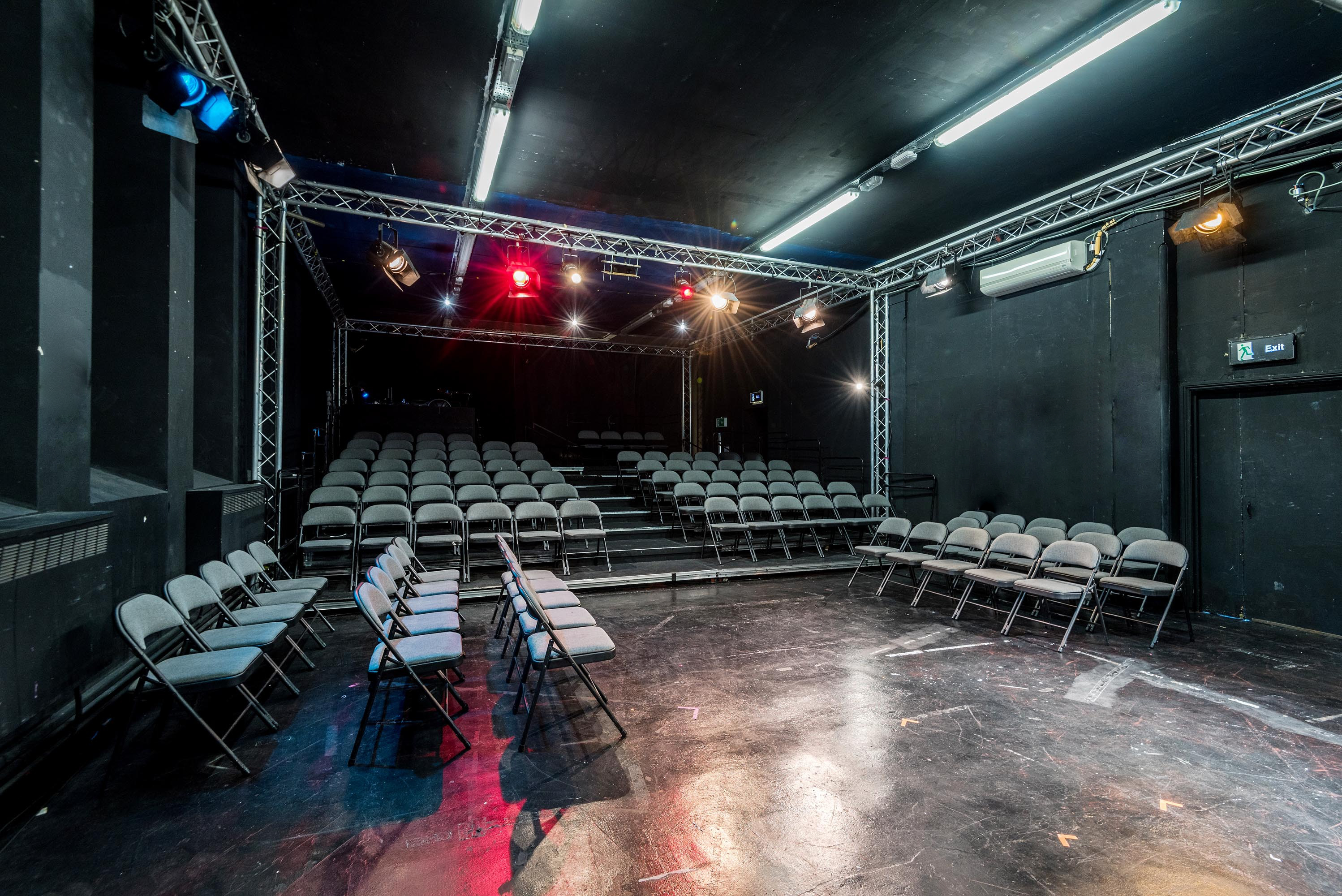 Theatre Space with tiered seating for versatile events at The Courtyard Theatre.
