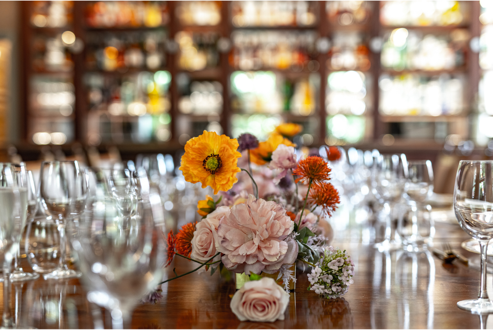Elegant dining table with floral centerpiece at Pickle Room, Trafalgar Tavern event.
