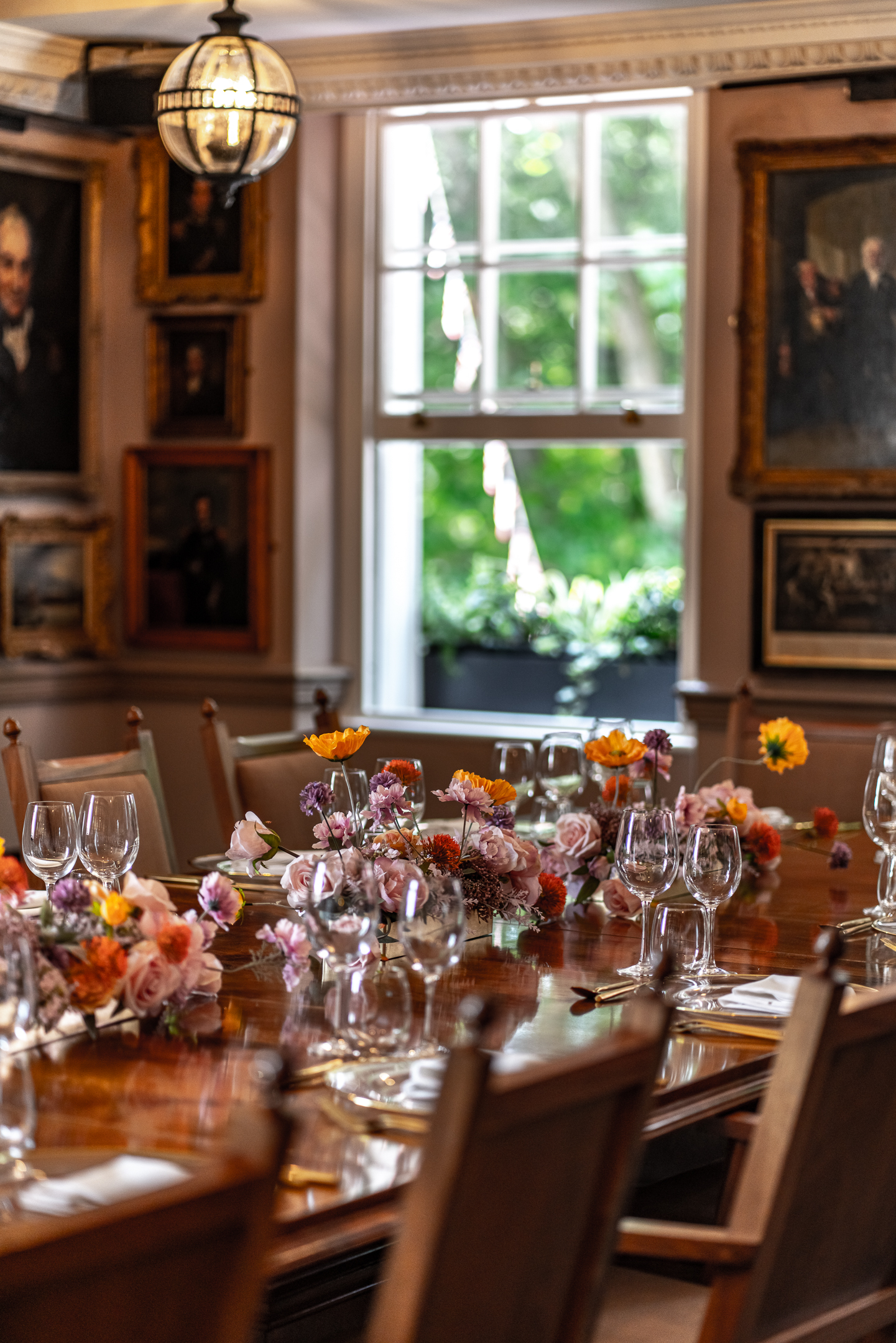 Elegant dining table with floral arrangements at Pickle Room, Trafalgar Tavern events.