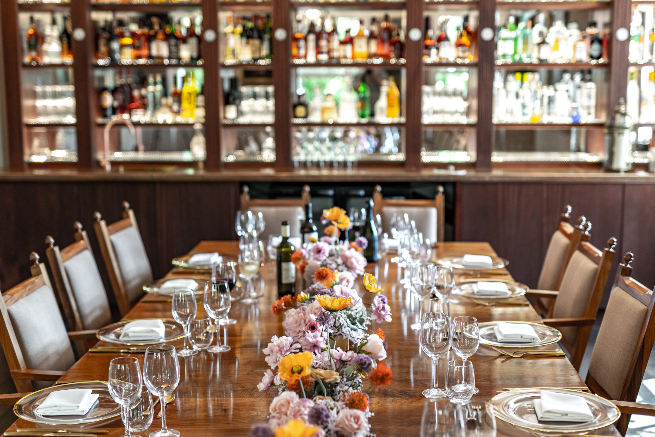 Elegant dining table with floral centerpiece at Pickle Room, ideal for corporate dinners.