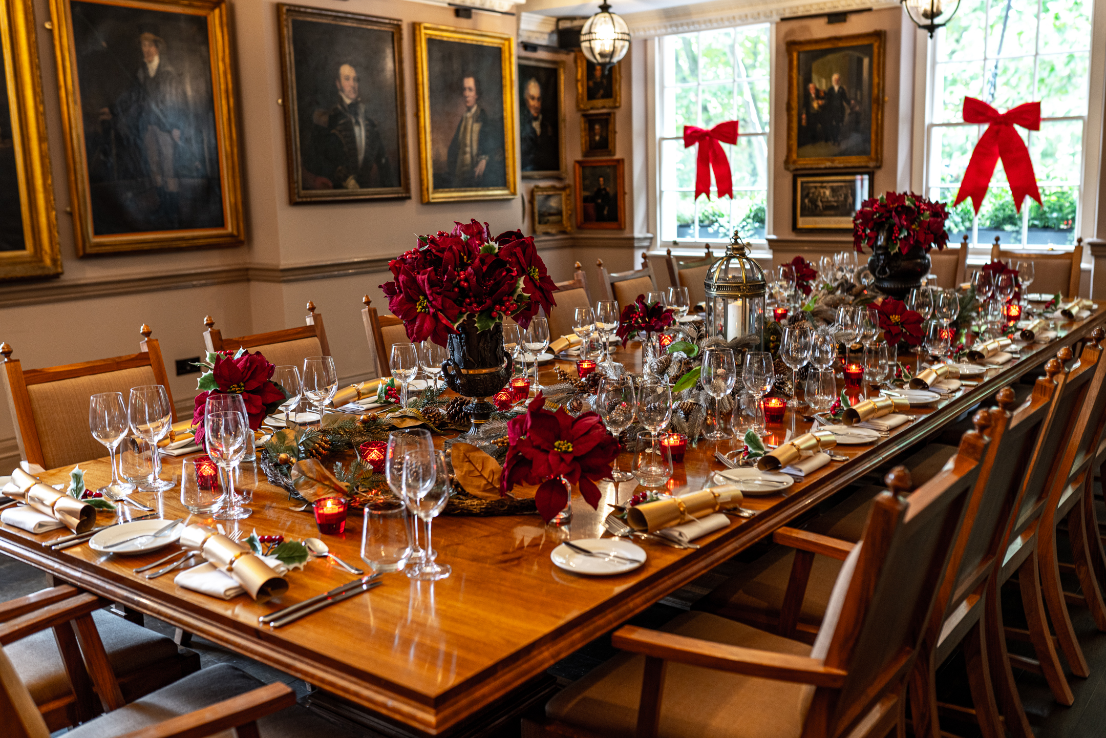 Elegant dining table with floral arrangements at Pickle Room, Trafalgar Tavern gala venue.