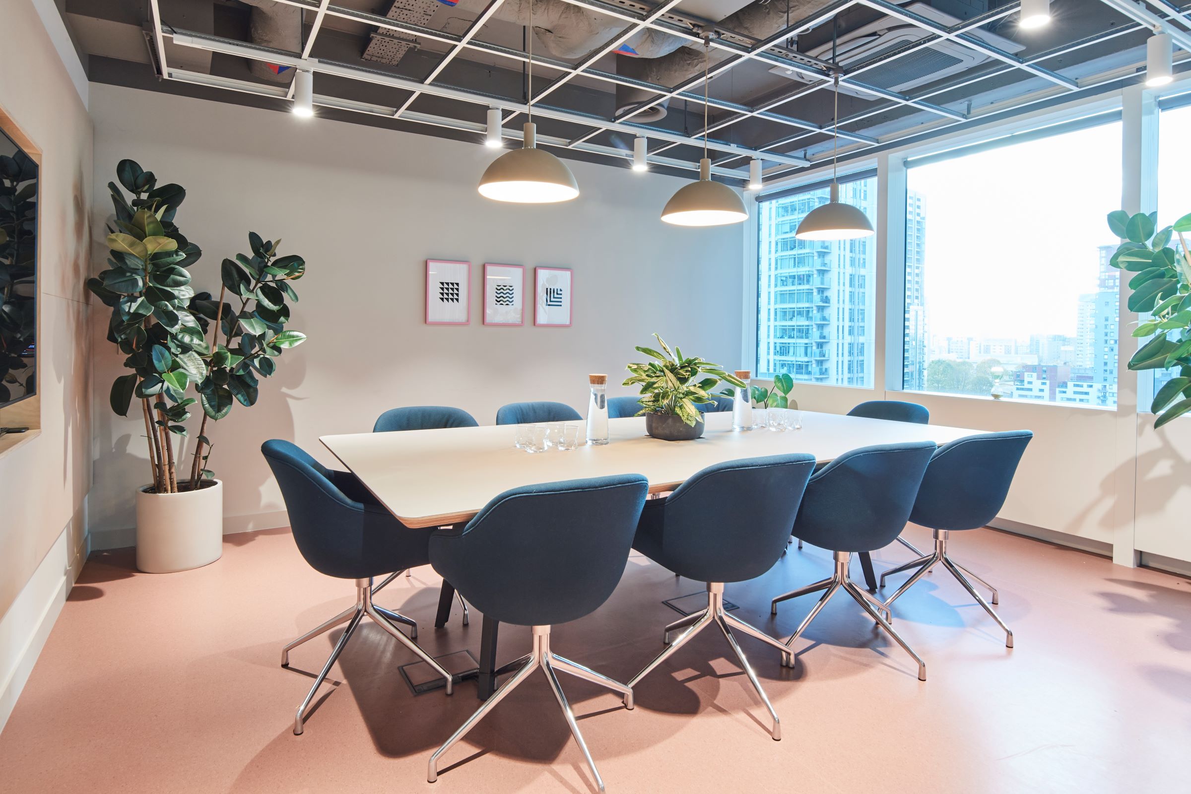 Modern Olympic meeting room in Sierra Quebec Bravo, featuring a large table and natural light.