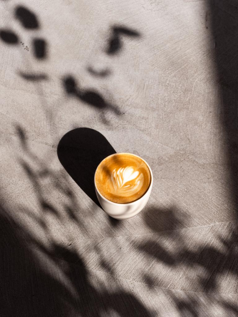 Latte art in a cozy setting, ideal for networking and casual meetings.