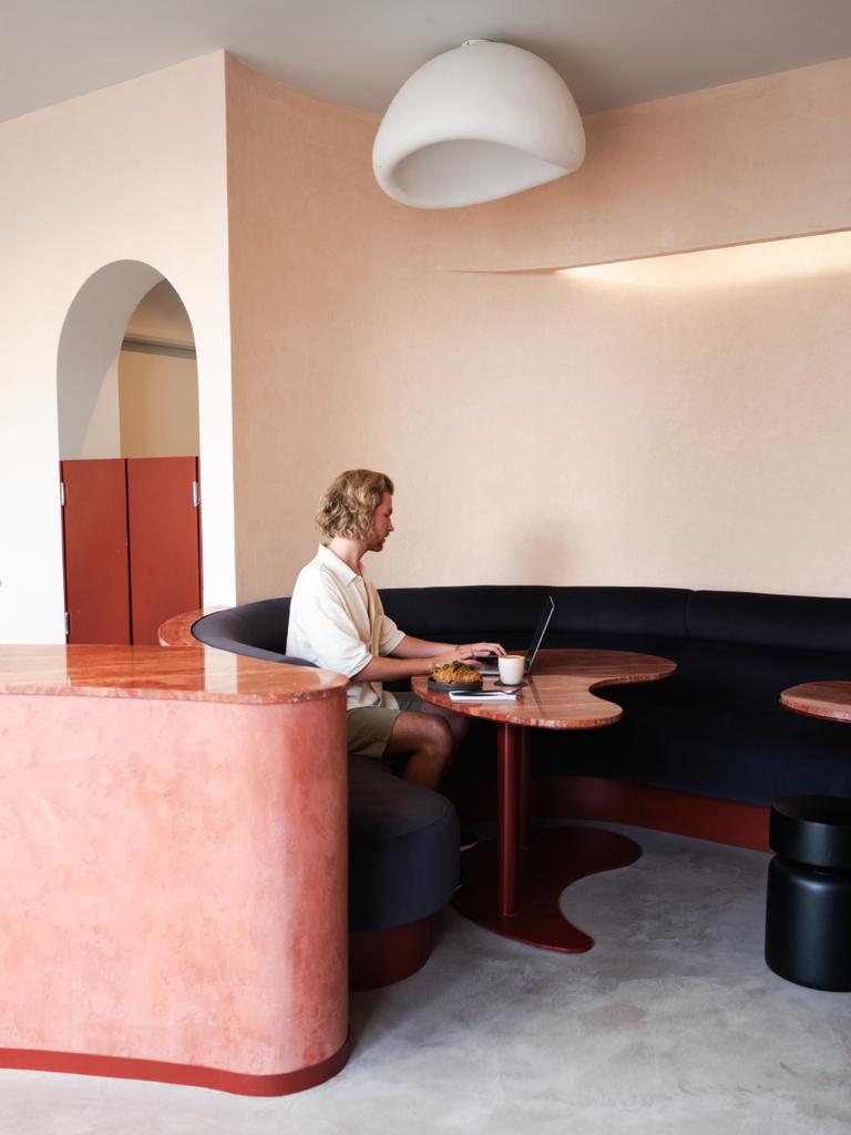 Modern workspace with curved seating for informal meetings and brainstorming sessions.