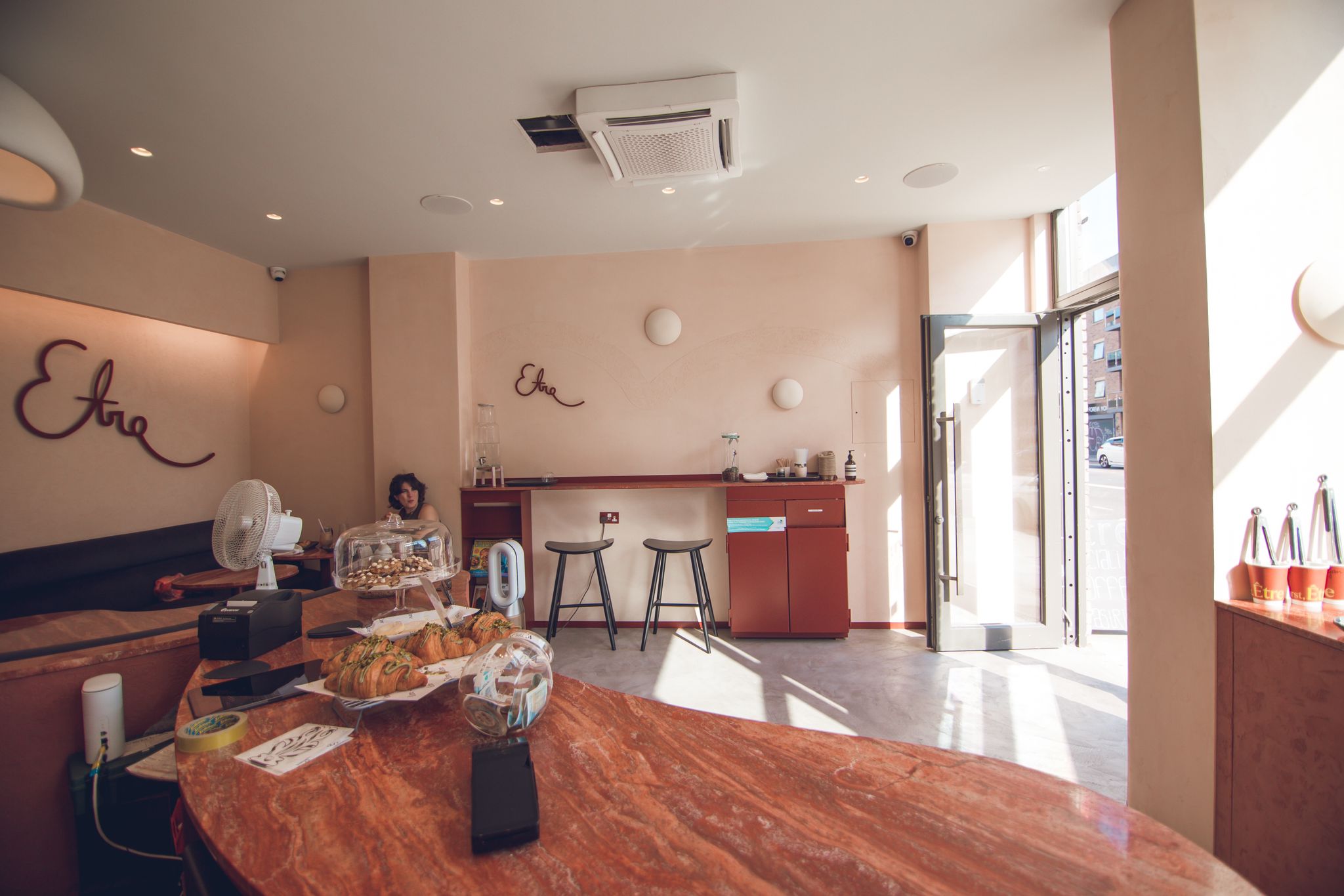 Stylish café with warm colors, ideal for networking events and casual meetings.