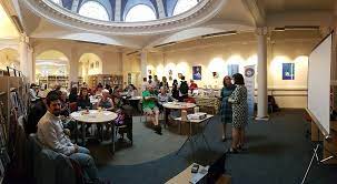 West Greenwich Library event with attendees engaged in a workshop and natural light ambiance.