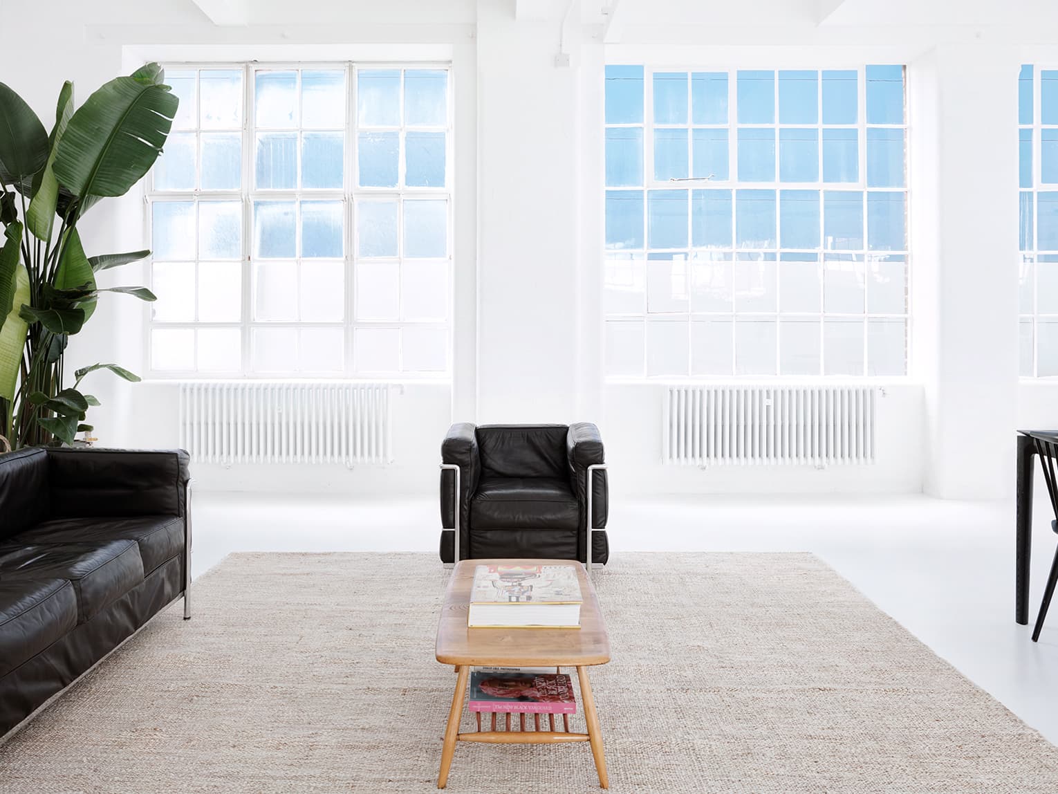 Minimalist Studio 1 boardroom for VIP strategy meetings and corporate events.