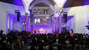Vibrant event space at The Rock Tower with dynamic lighting for conferences and performances.
