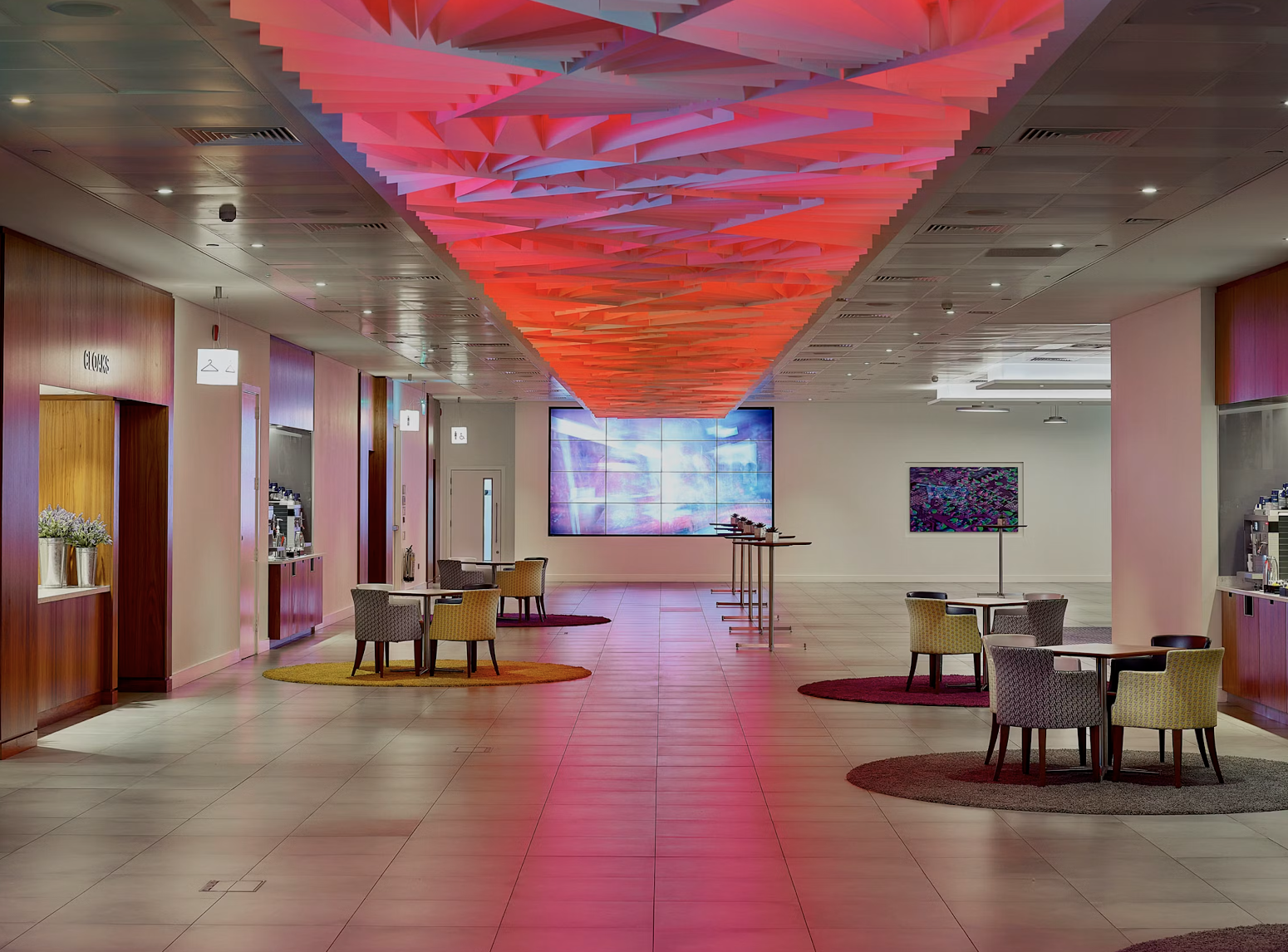 Modern event space with vibrant ceiling at Broadgate Suite, ideal for corporate gatherings.