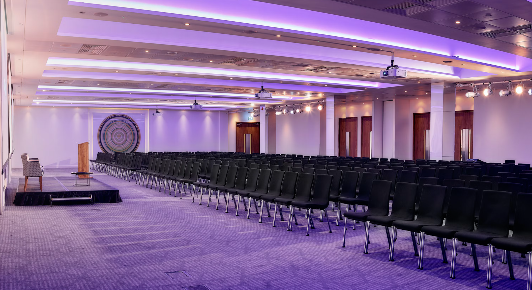 Broadgate Suite at Convene: spacious event space for conferences with modern lighting.