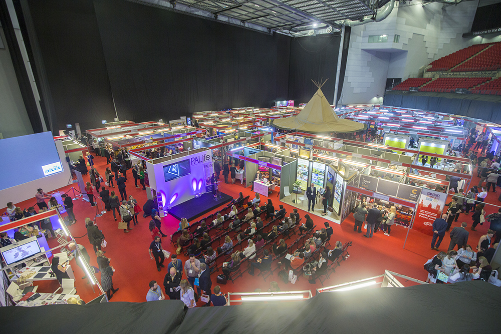 "First Direct Arena Leeds exhibition hall with vibrant booths for trade shows and conferences."
