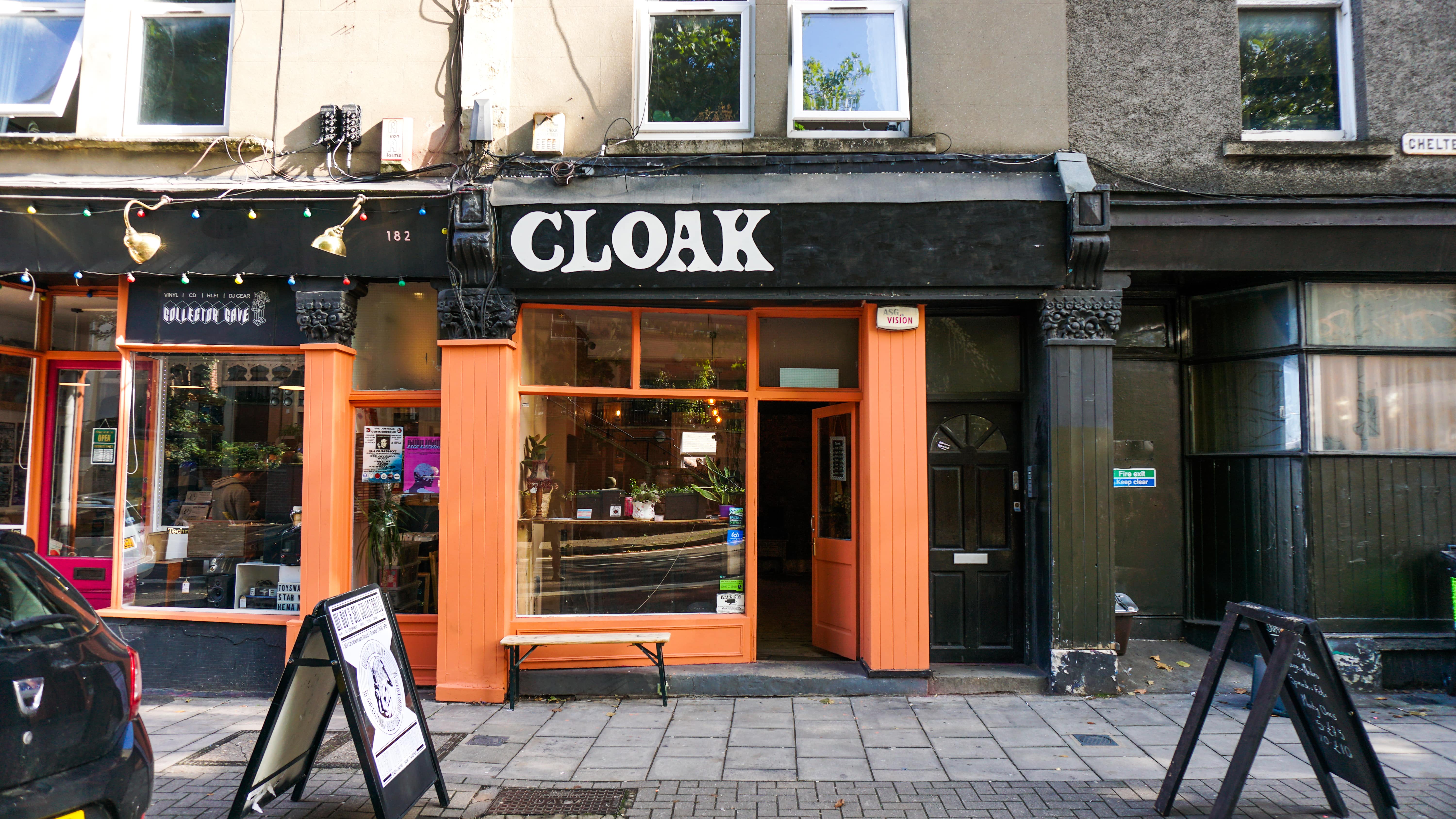 Cloak Cafe/Bar with modern facade and vibrant accents, perfect for unique events.