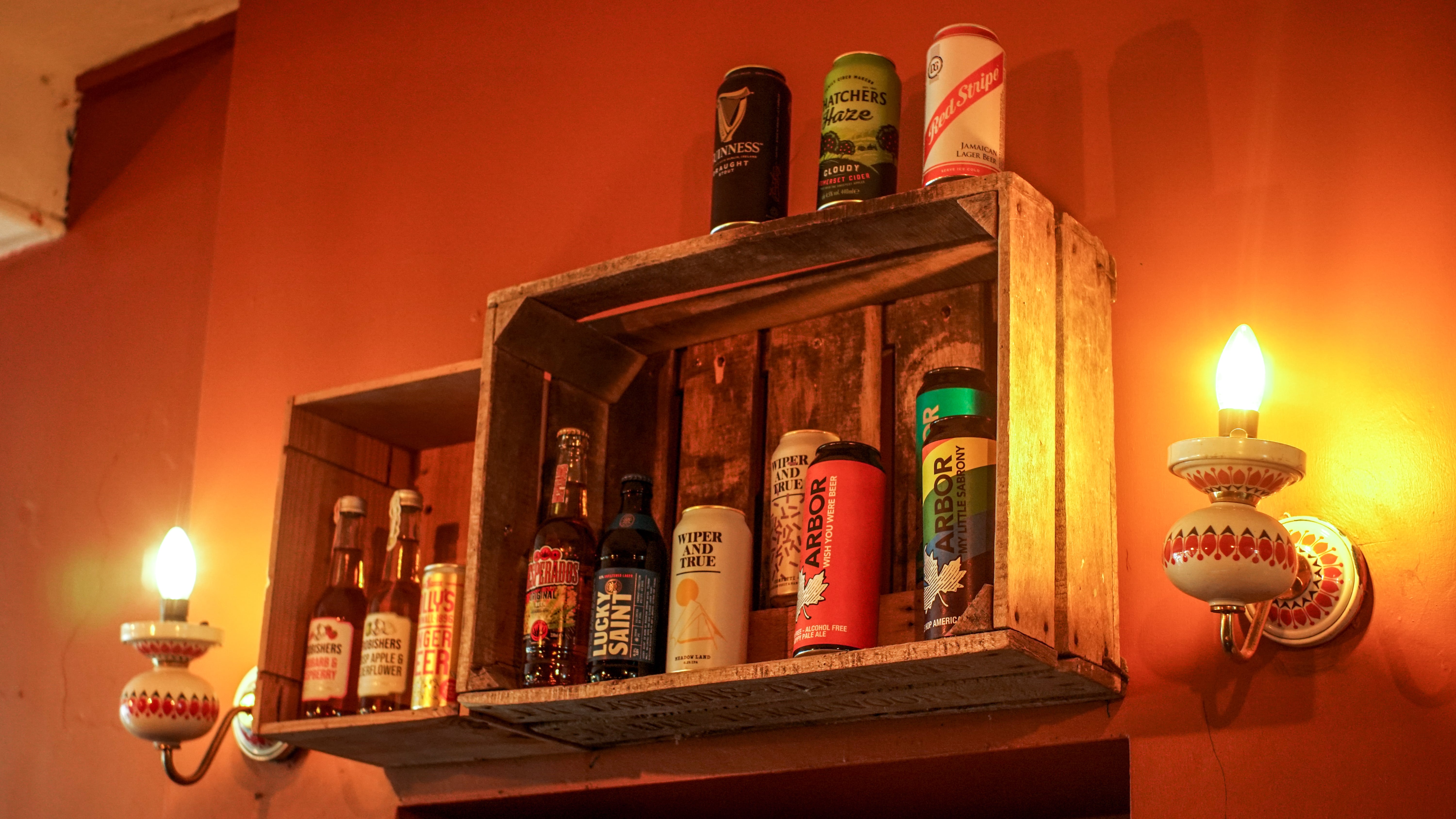 Cloak Cafe/Bar beverage display, rustic charm for networking events and socializing.