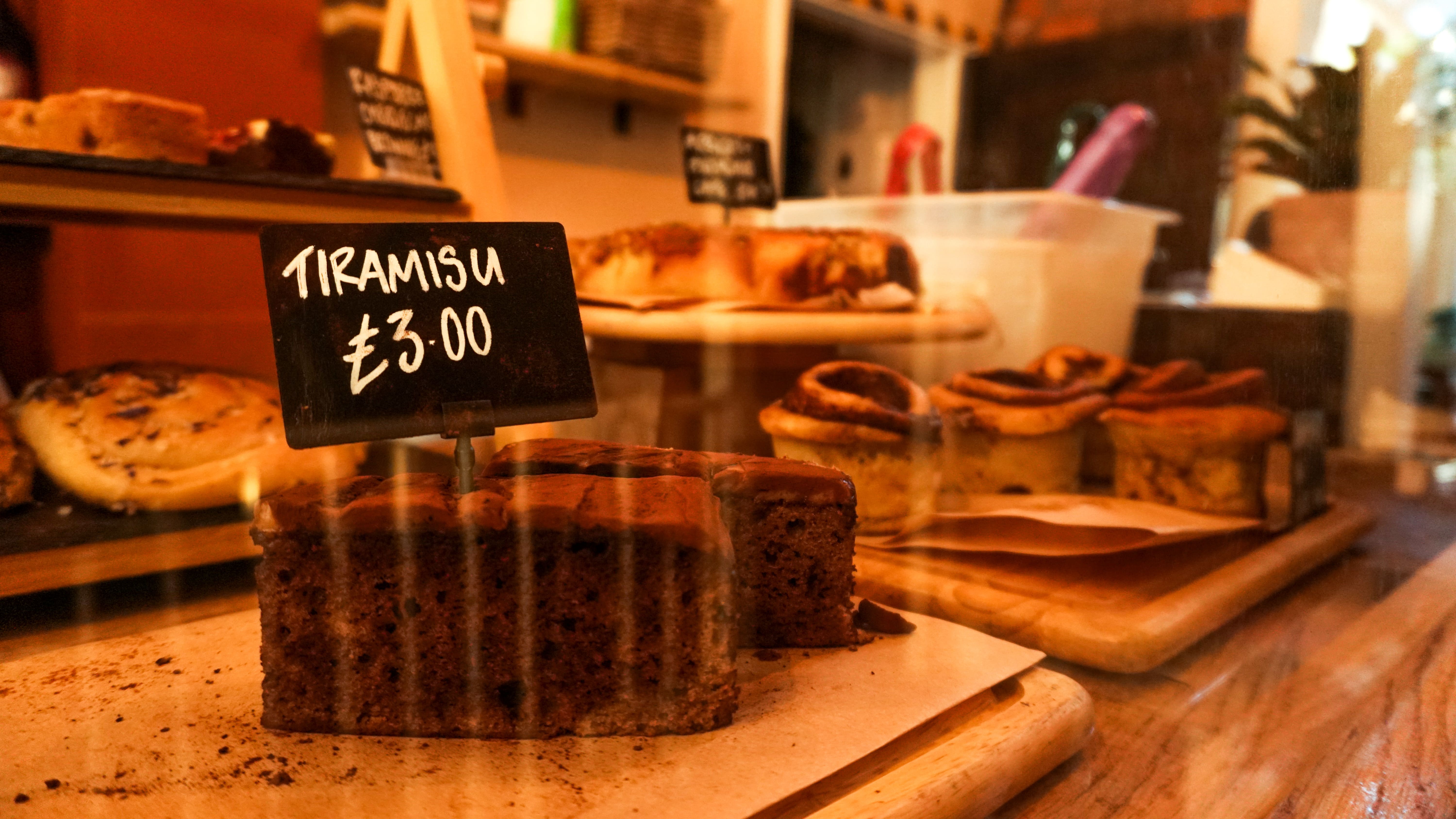 Cloak Cafe dessert display with tiramisu, perfect for events and catering.