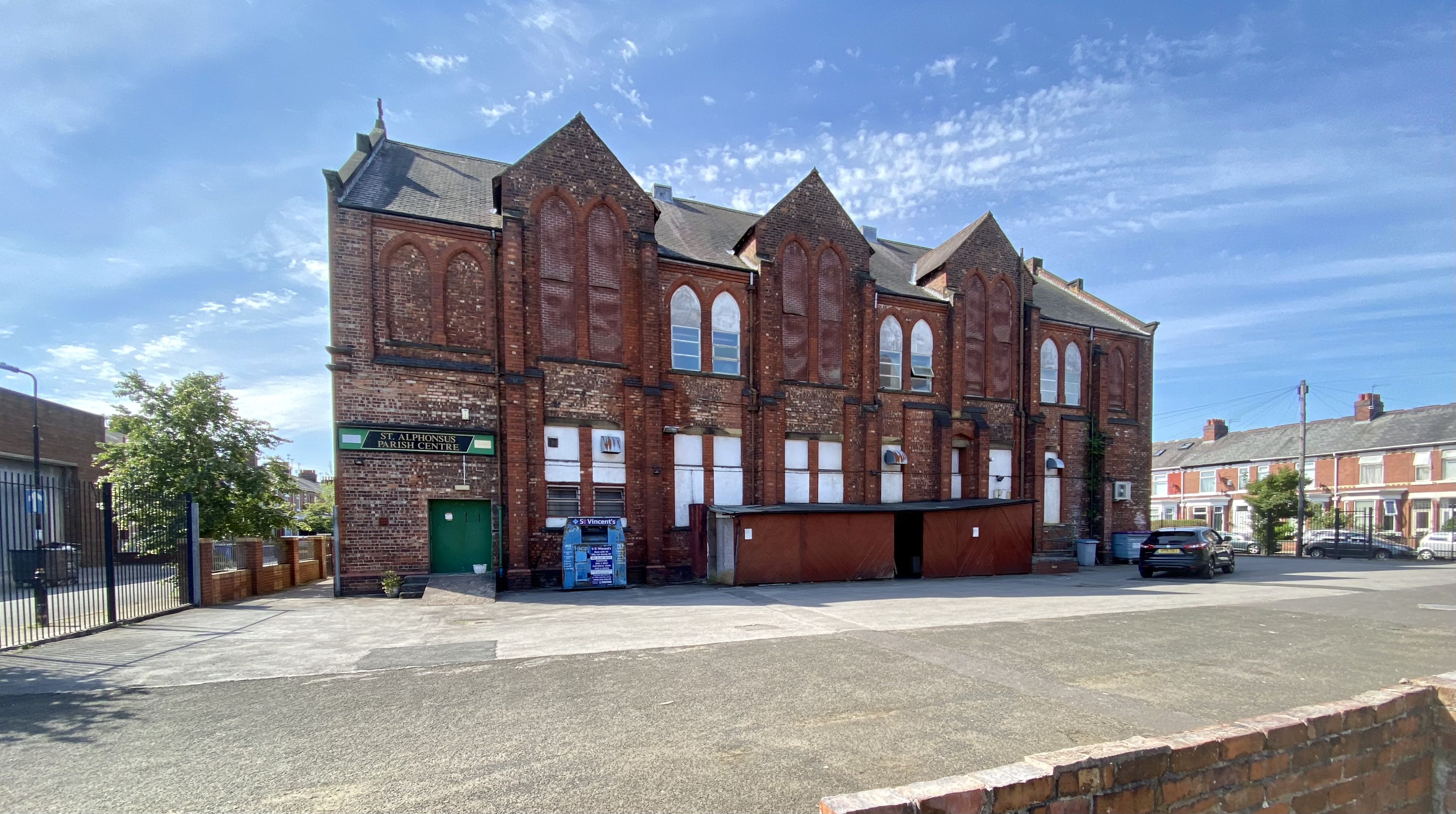Main function room at St Alphonsus Parish Centre, charming brick venue for events.