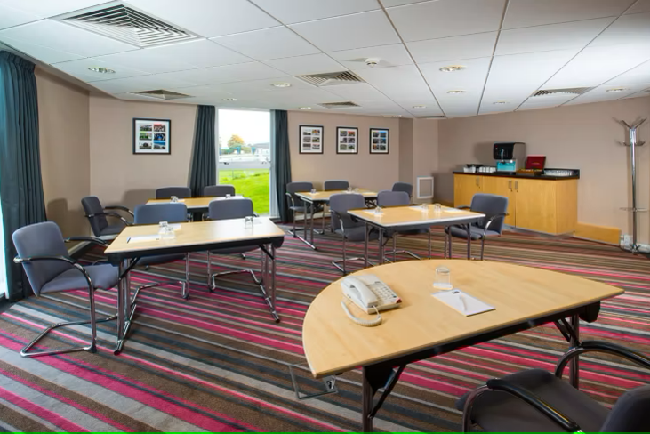 Dettori Room at Holiday Inn Express: modern meeting space with natural light for events.