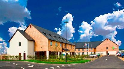 Modern Dettori Room at Holiday Inn Express, ideal for meetings and events with outdoor space.