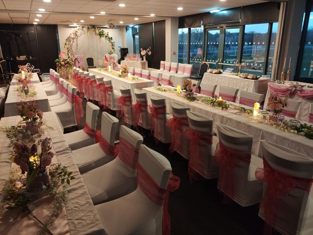 Milburn Lounge event space with elegant tables, perfect for weddings and celebrations.