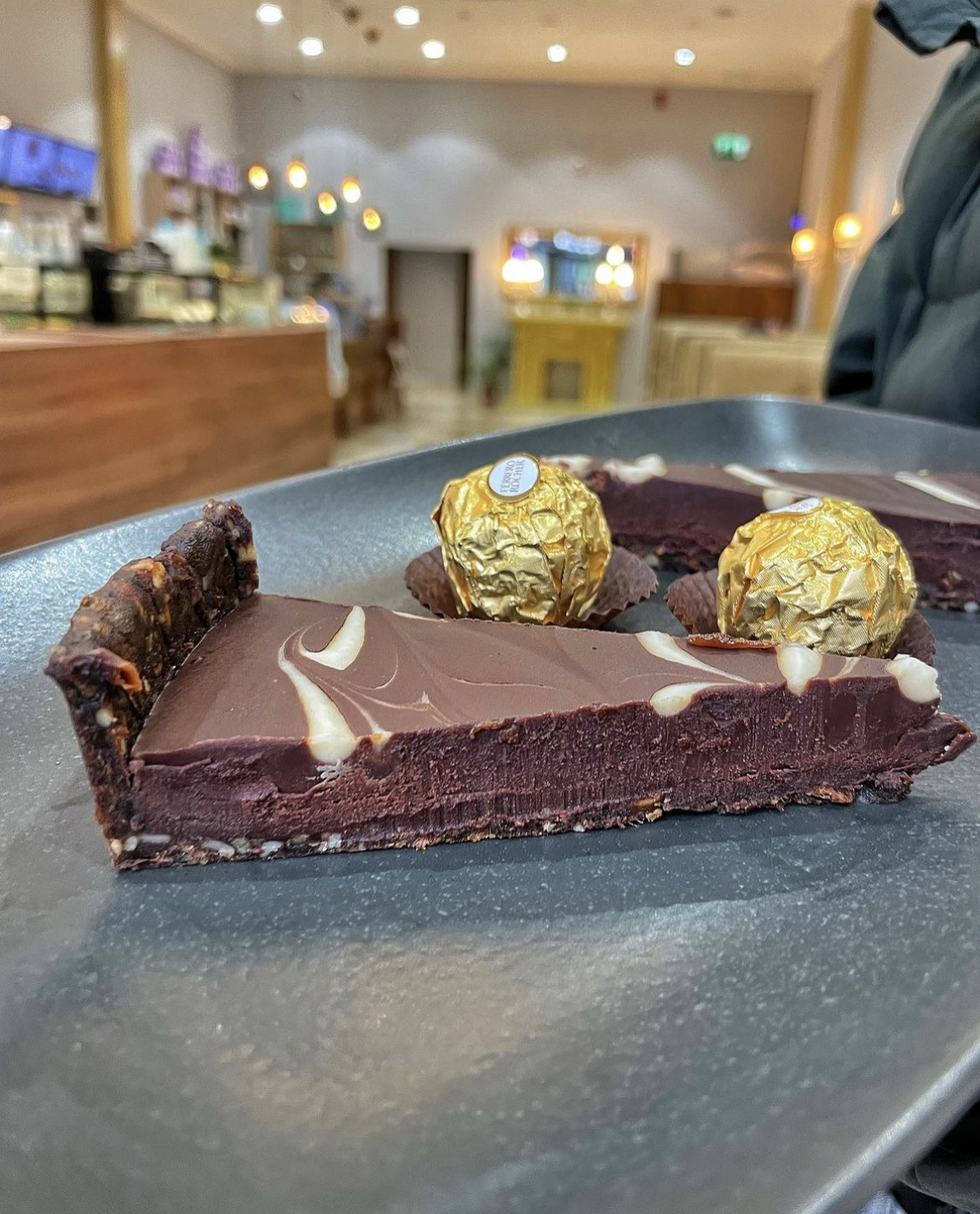 Elegant chocolate tart and truffles for upscale weddings and corporate events.