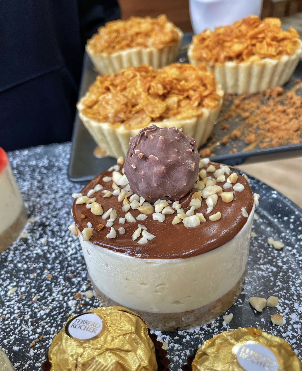 Rich chocolate cake and caramel treat at CREMA Dolce coffee event.