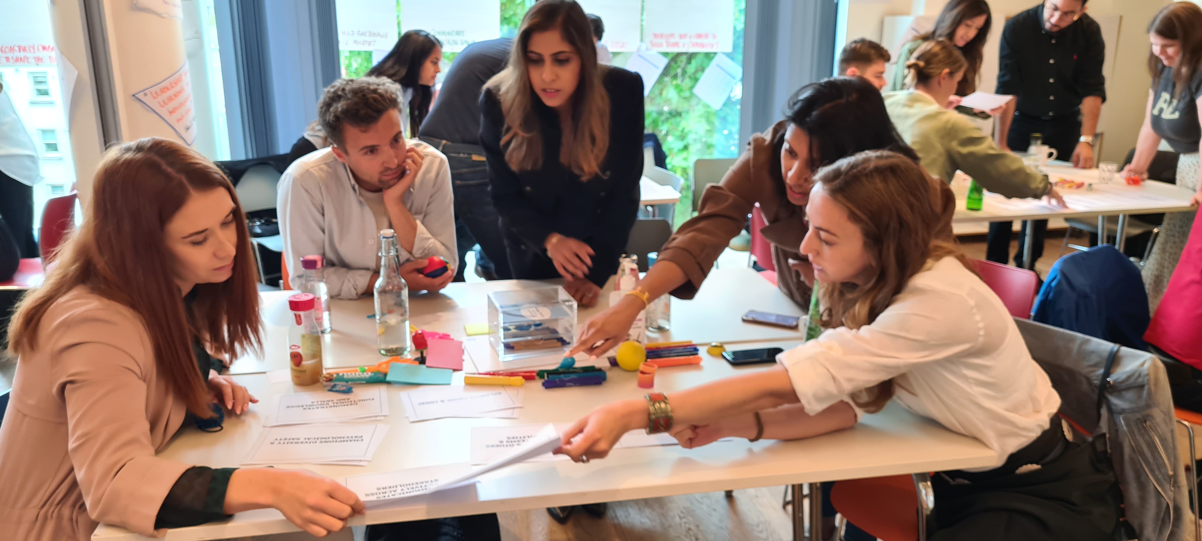 "Collaborative brainstorming session with colorful stationery at Away Days workshop"