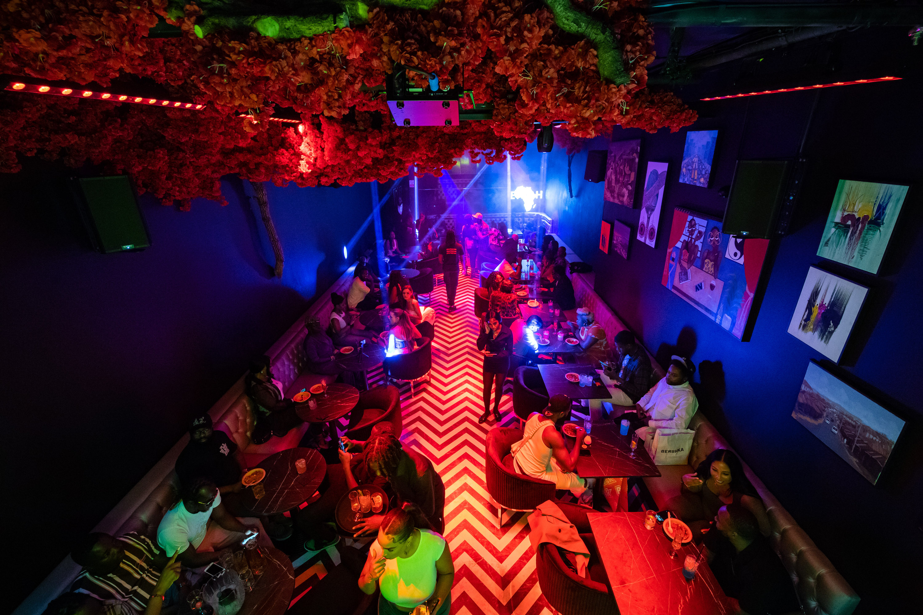 Vibrant Enish Restaurant lounge with colorful decor, ideal for social gatherings and events.