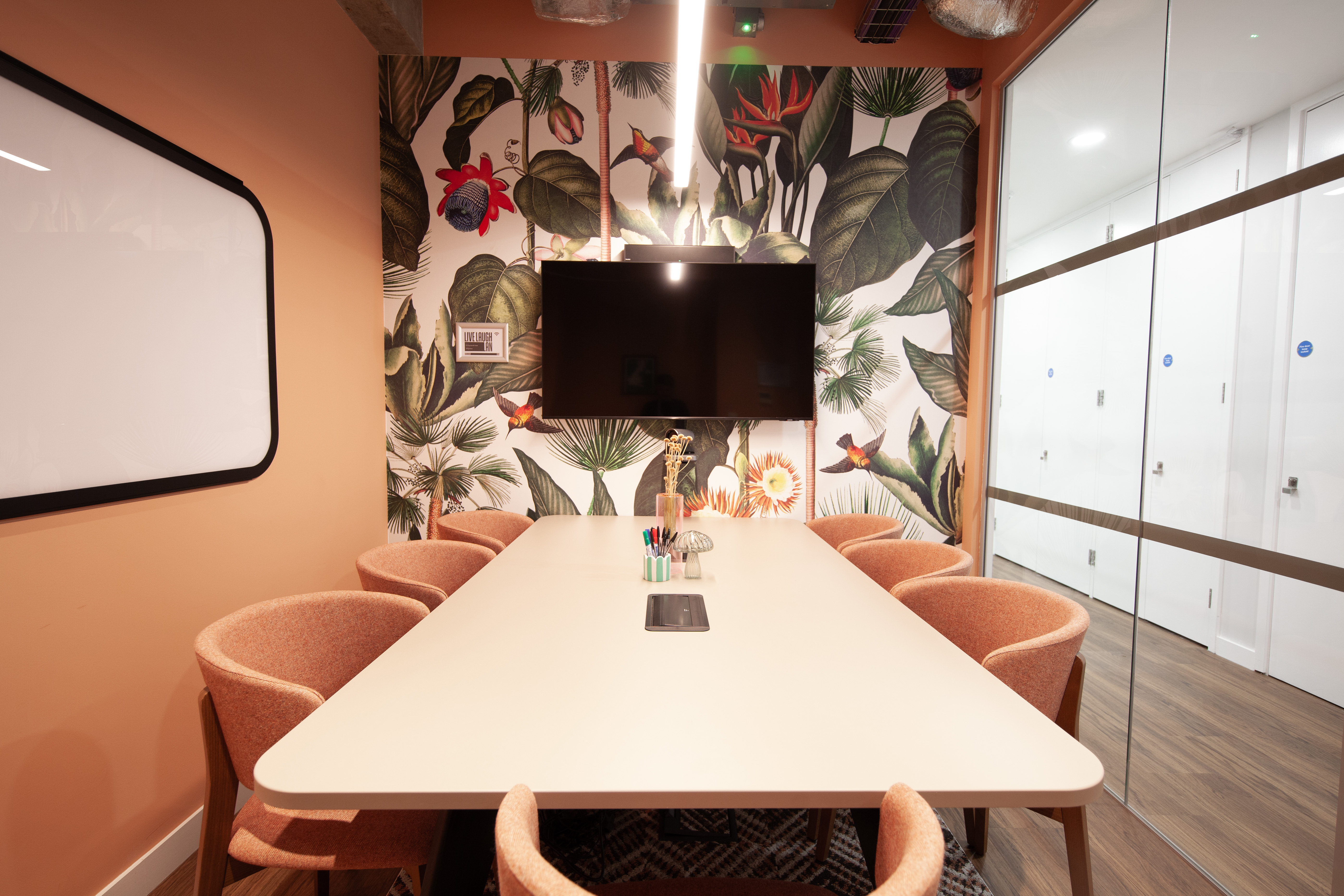 Modern meeting room in Hobhouse, Runway East Bloomsbury, with vibrant wallpaper for collaboration.