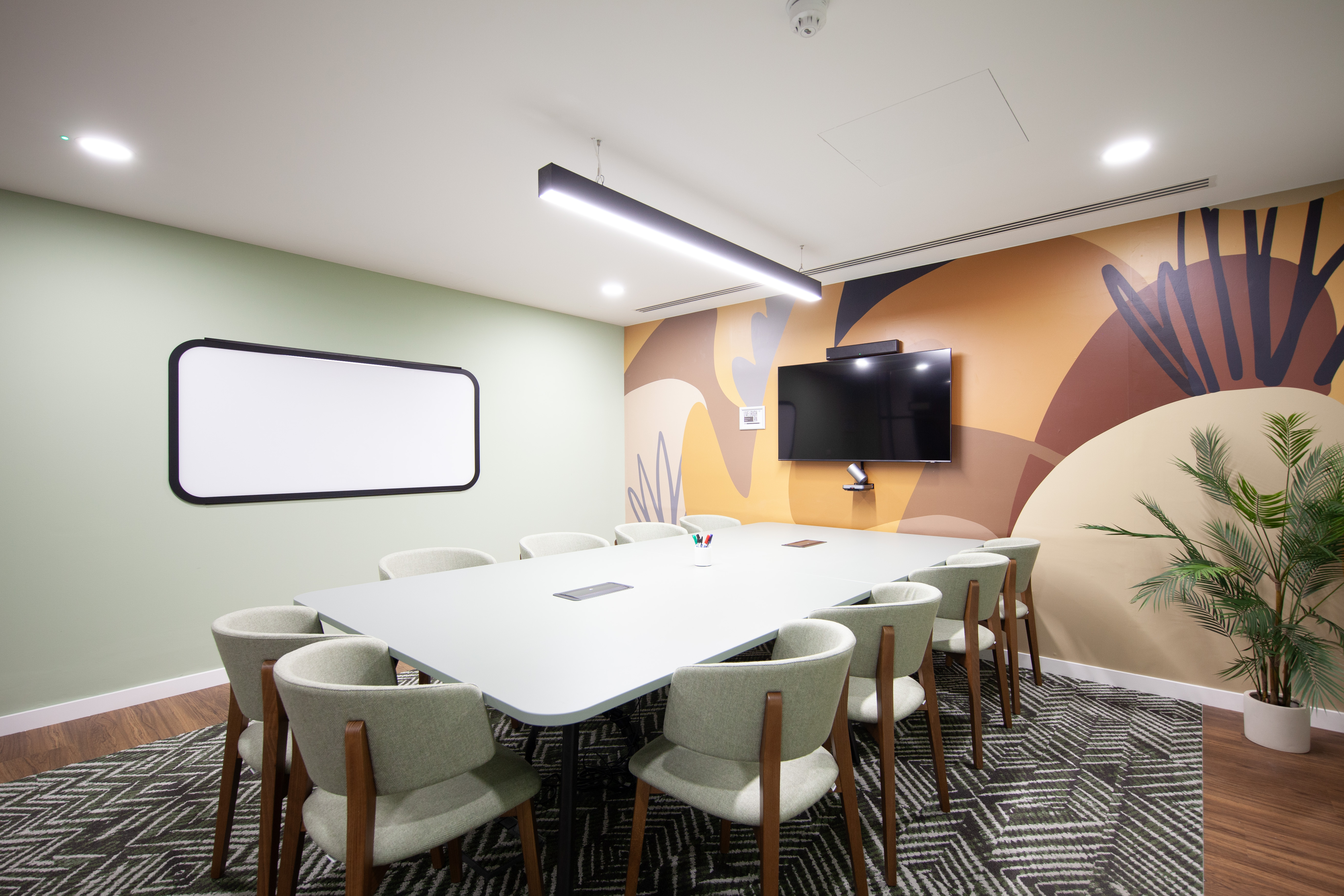 Modern meeting room in Runway East Bloomsbury with vibrant wall art for creative events.