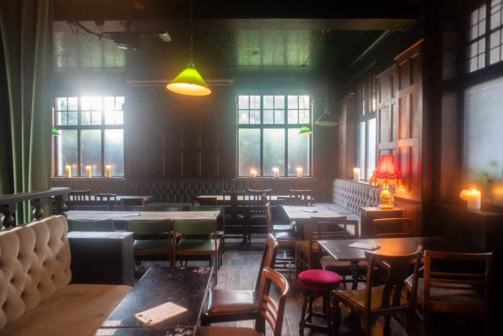 Cozy semi-private venue with warm lighting for intimate gatherings and networking events.