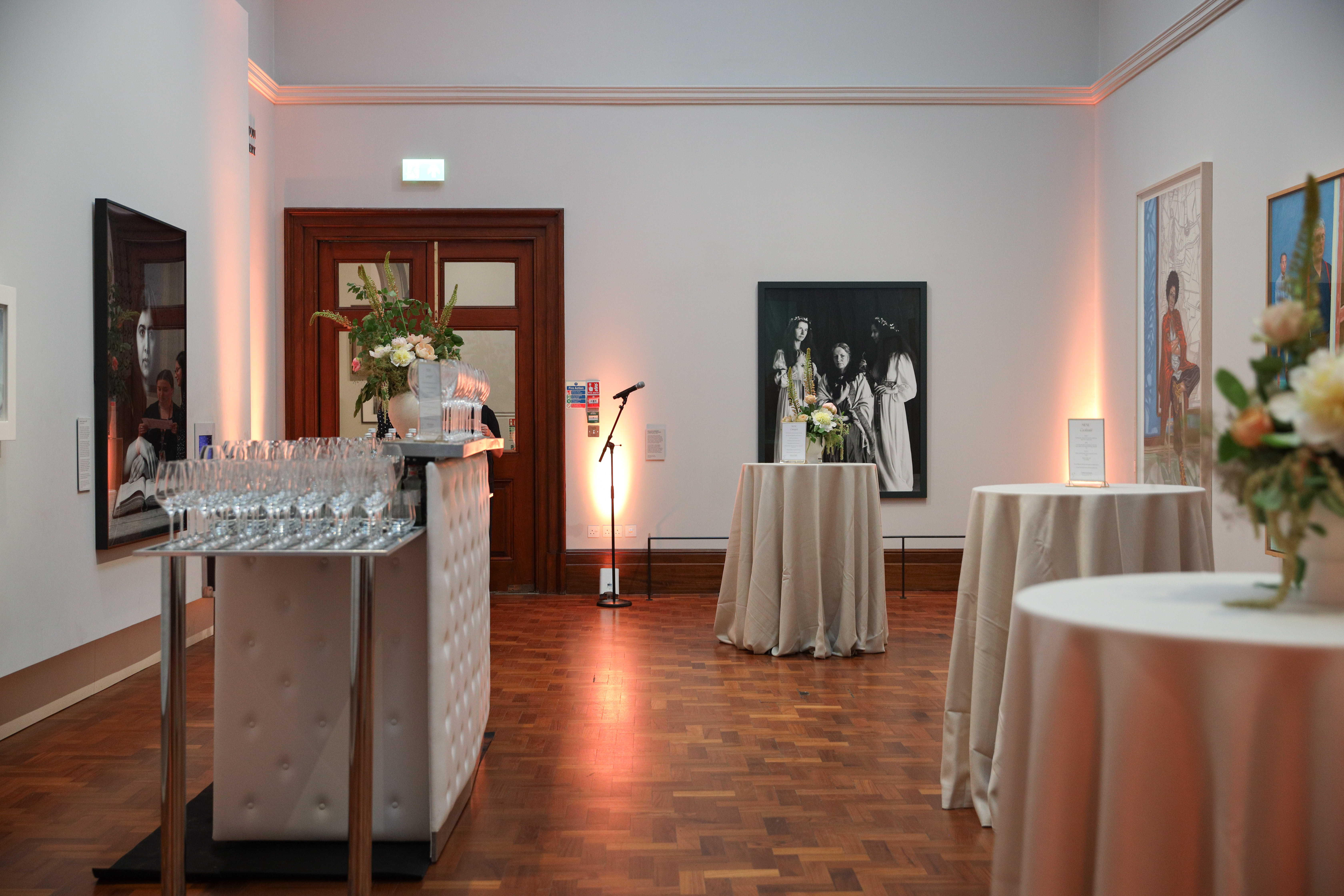 Contemporary Galleries reception setup with elegant bar and soft lighting for events.