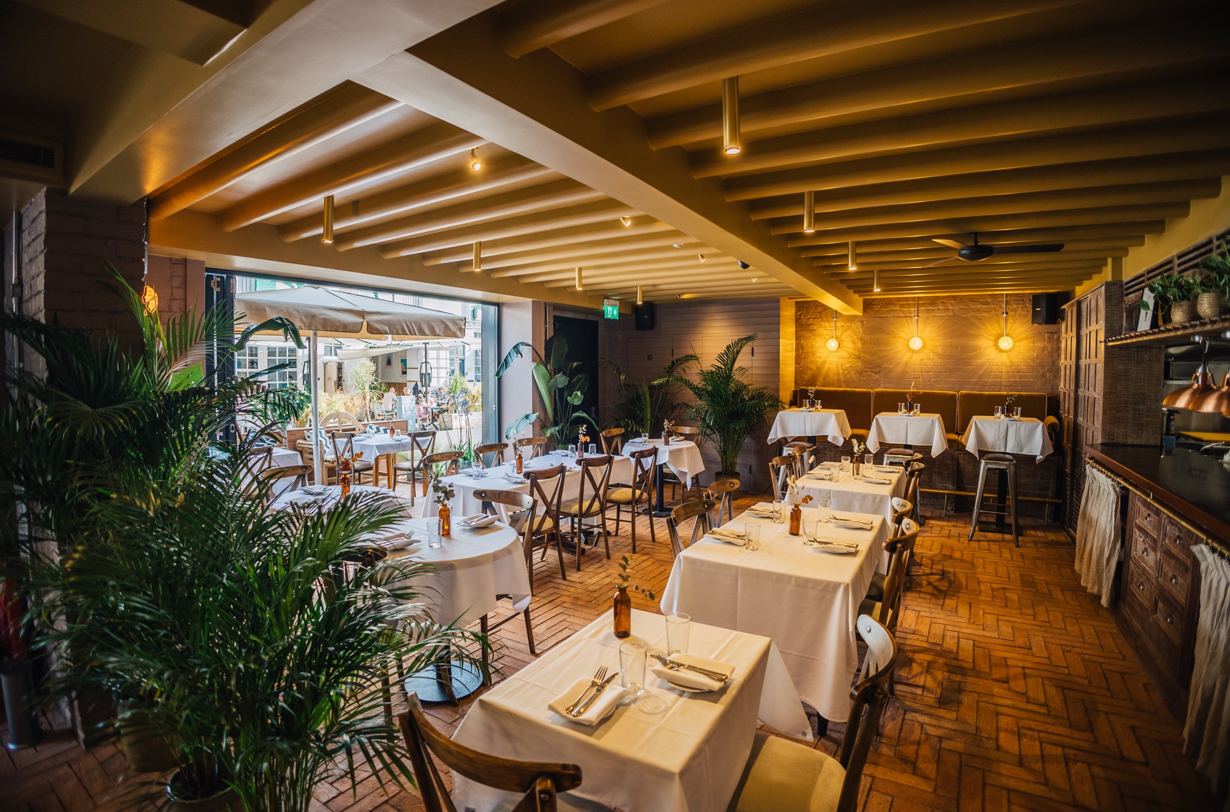 Stylish LULA restaurant main room with warm lighting, perfect for intimate events.