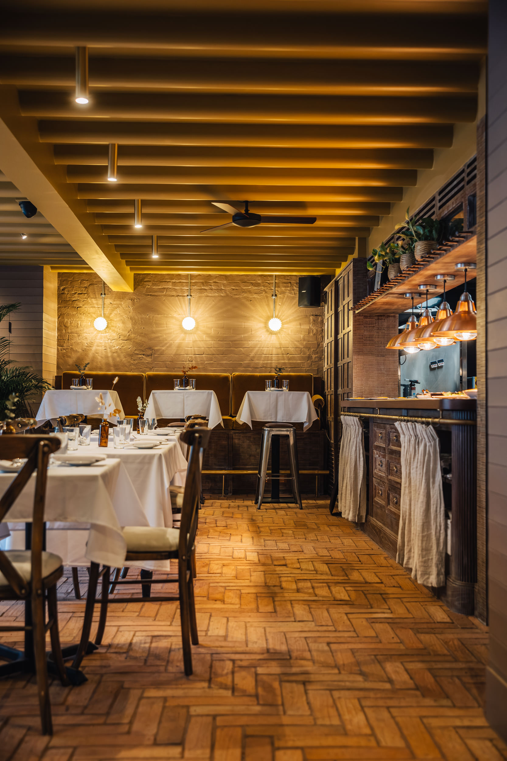 Stylish dining space in LULA with warm lighting for intimate gatherings and corporate events.