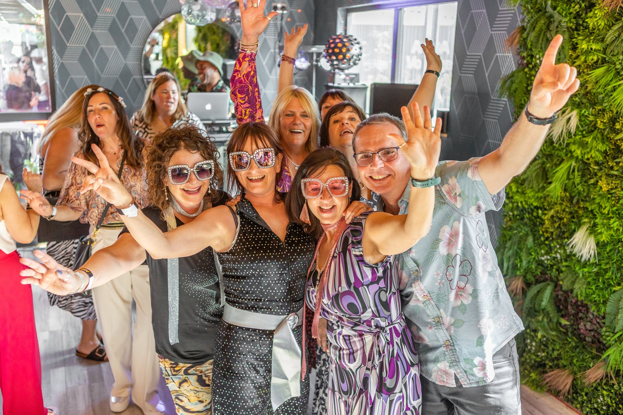 Vibrant attendees at Event Bar, Snoozebox Olympic Park, celebrating a lively networking event.