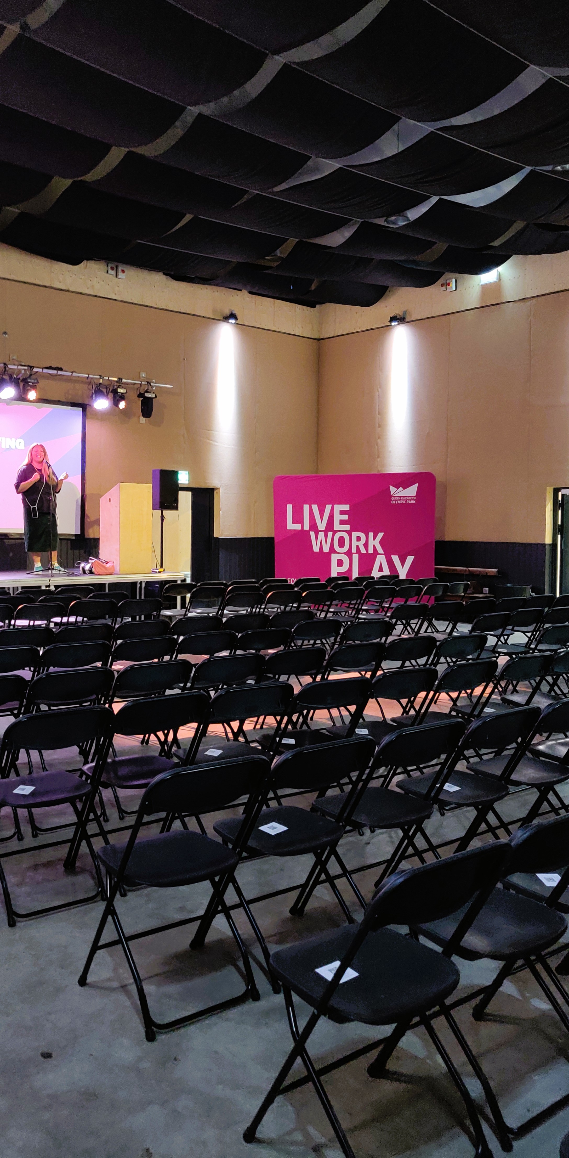 Event space in Hackney Bridge with stage for engaging presentations, ideal for networking.