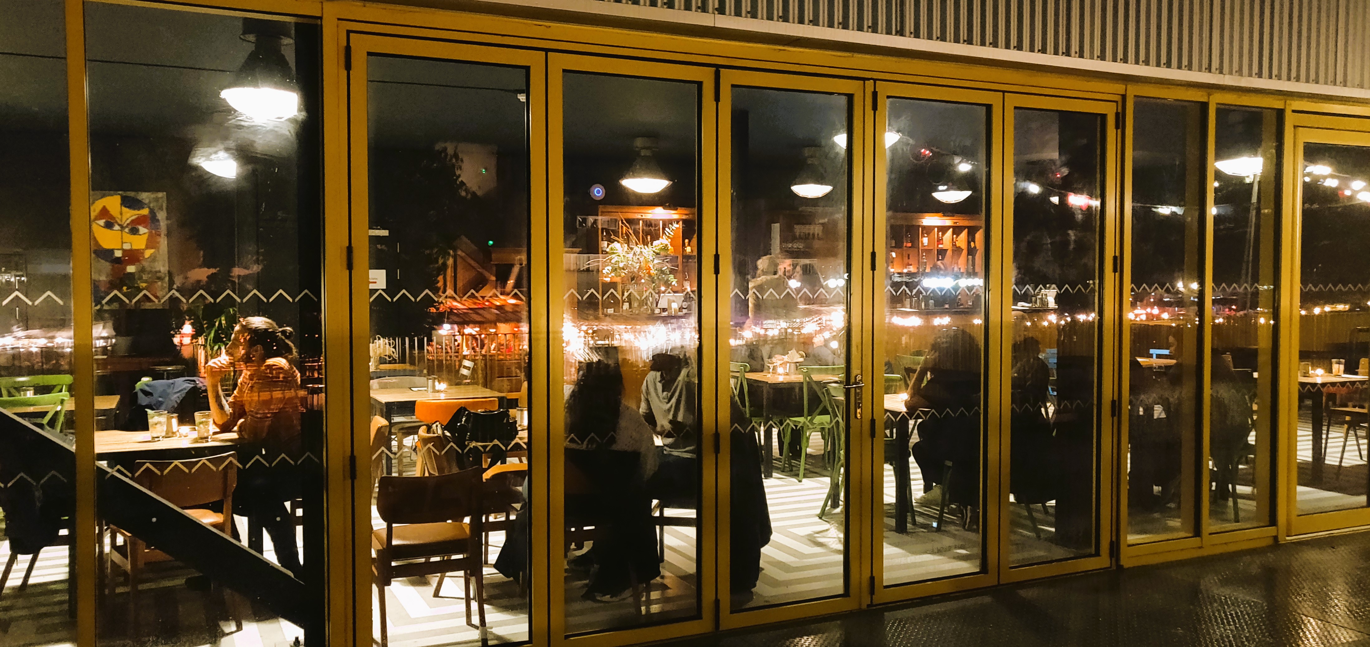 Vibrant dining space at Nico's Bar, Hackney Bridge, ideal for networking and events.