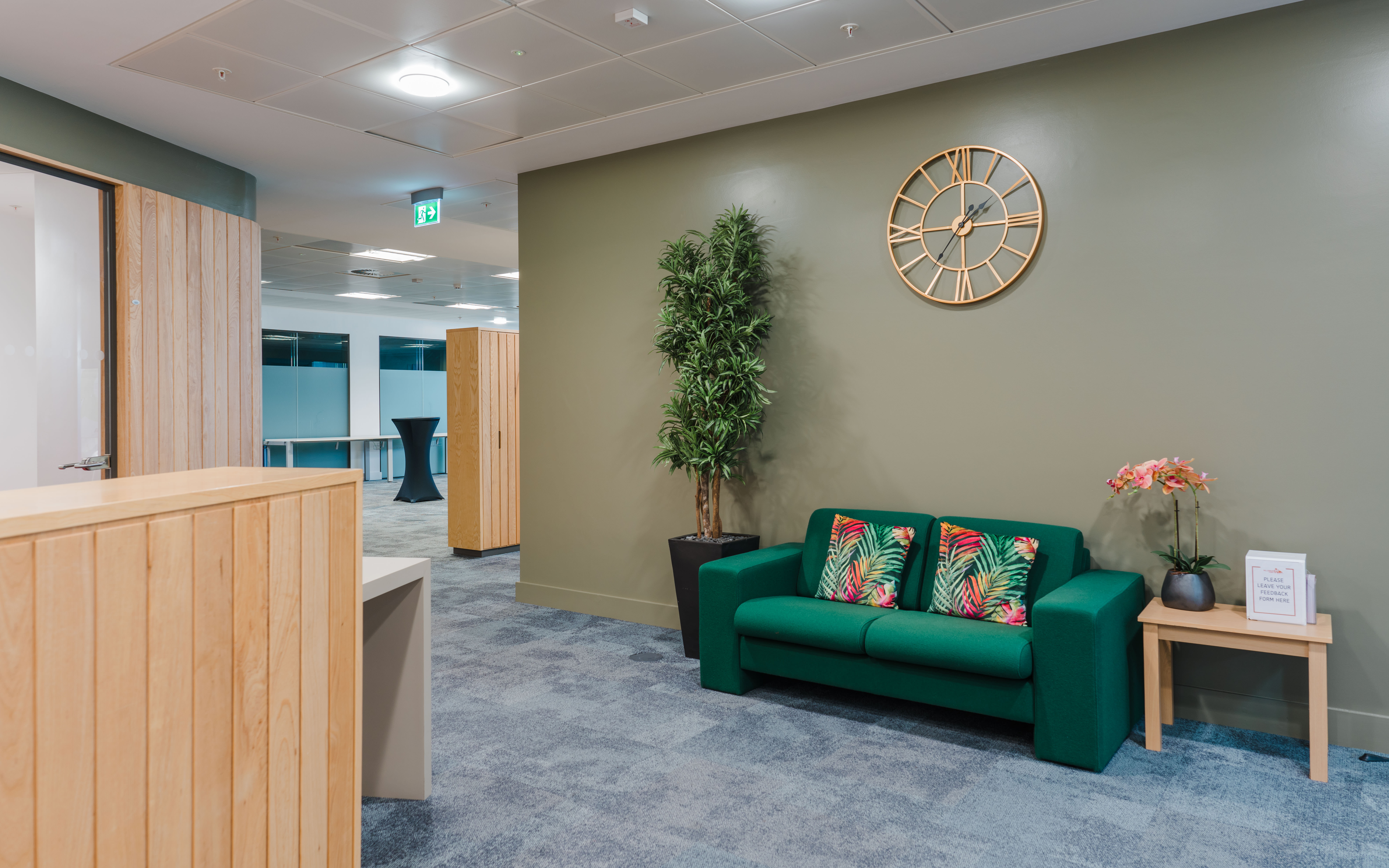 Modern lounge at Millennium Point with green sofa, ideal for networking events.
