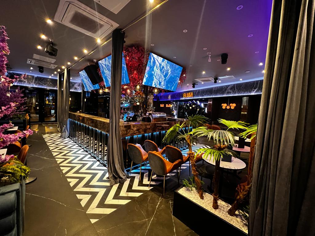 Stylish event space at Pizza Loca with modern decor for corporate and social events.