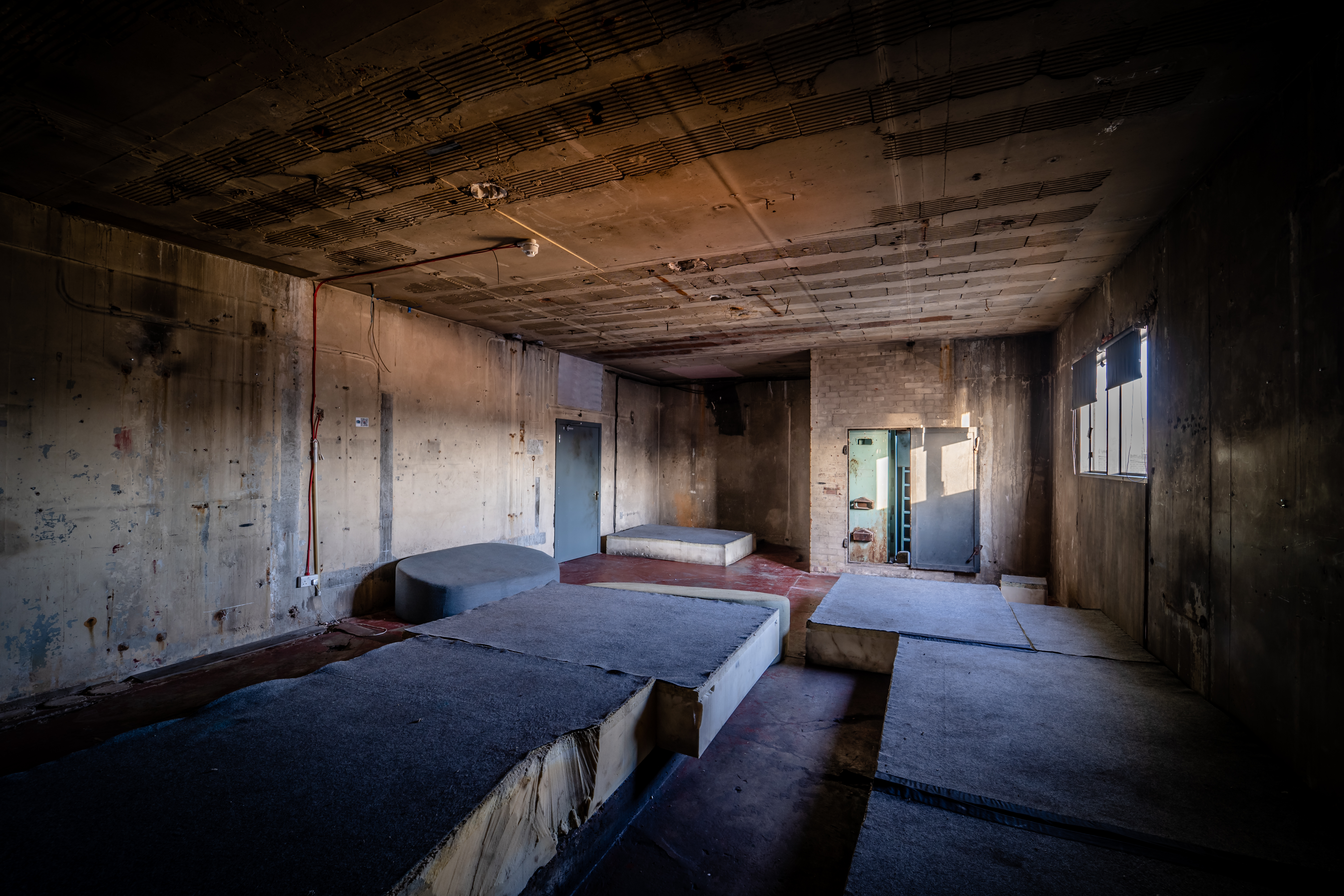 Industrial boiler room venue with exposed concrete, perfect for edgy events and workshops.