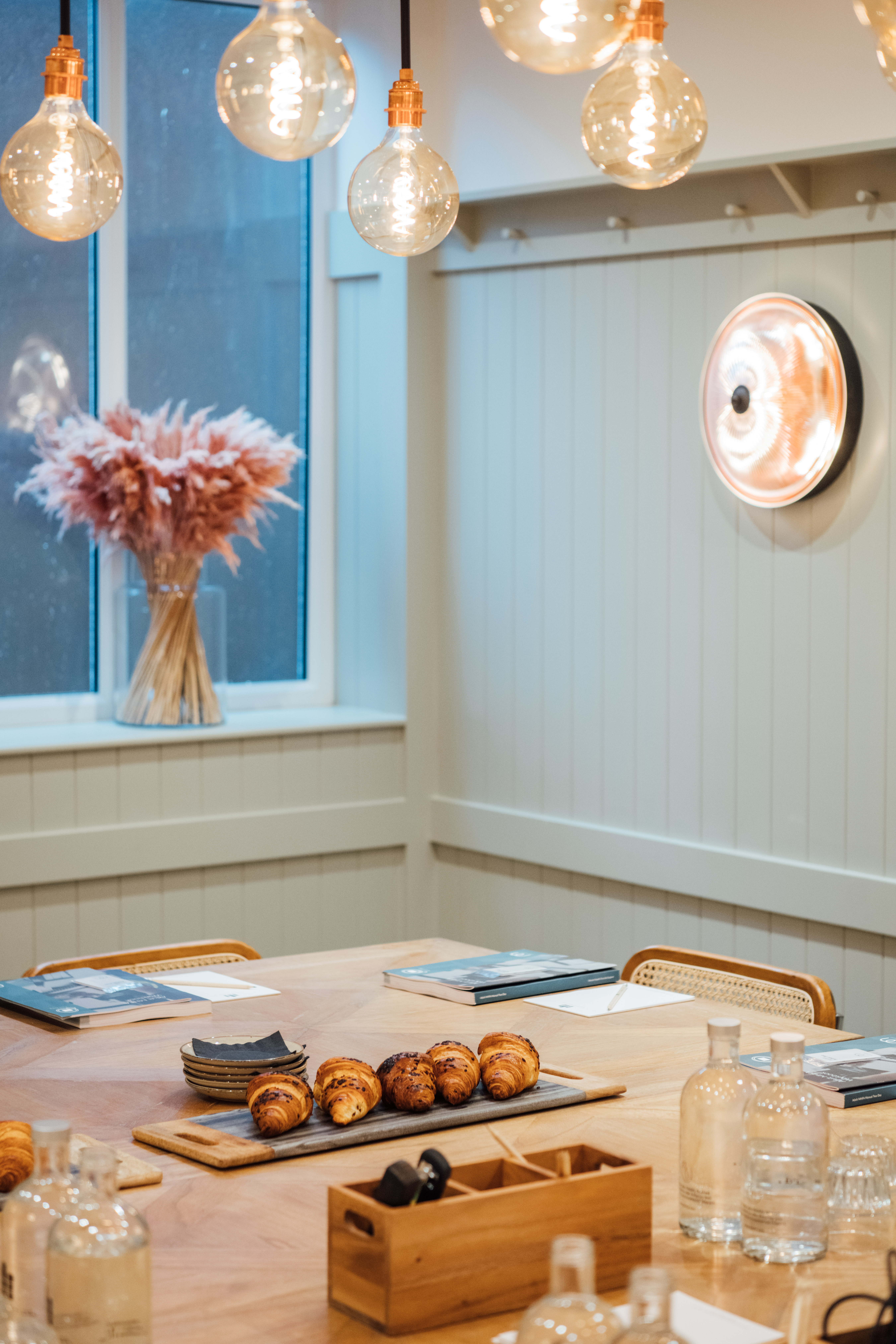Cozy minimalist meeting space at Hermitage Rd Coffee & Bagel Bar for brainstorming sessions.