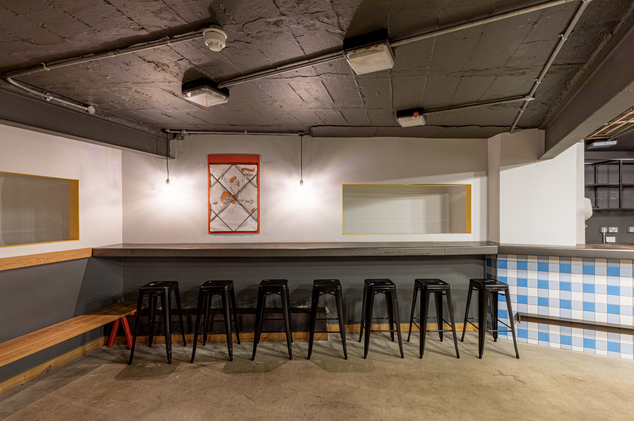 Versatile event space with sleek bar, ideal for gatherings and networking in Medley Market.