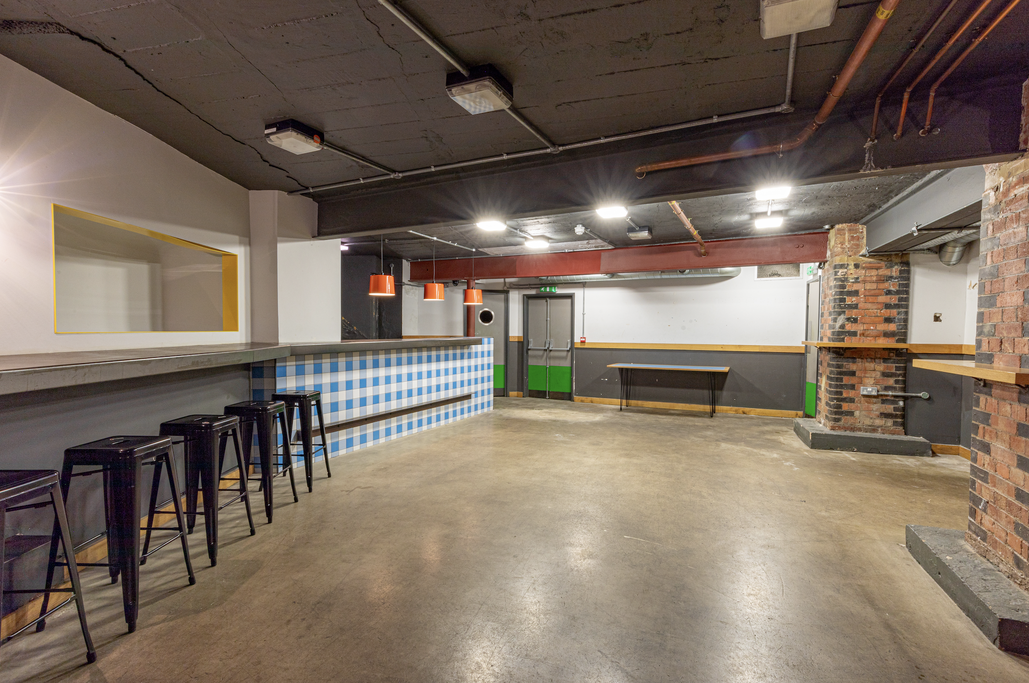 Medley Market: industrial event space with exposed brick for networking and gatherings.