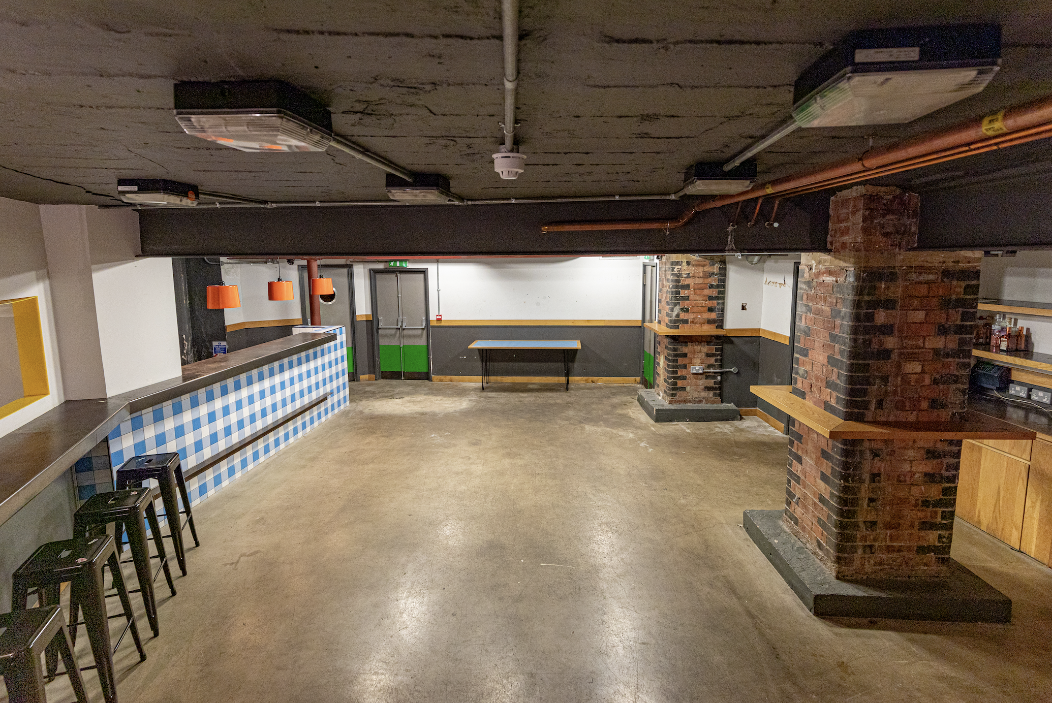 Medley Market event space with exposed brick, ideal for gatherings and flexible seating.