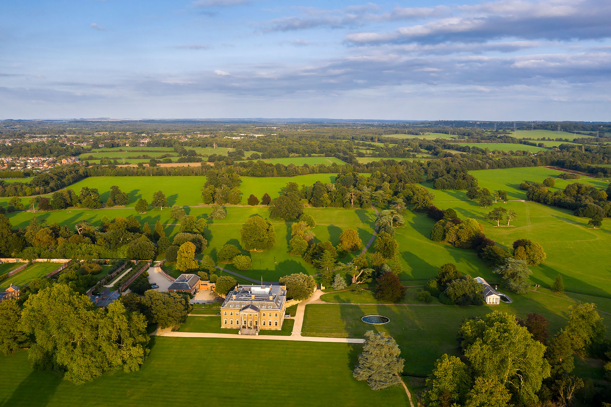 Broadlands Park estate with lush greenery, perfect for outdoor events and gatherings.